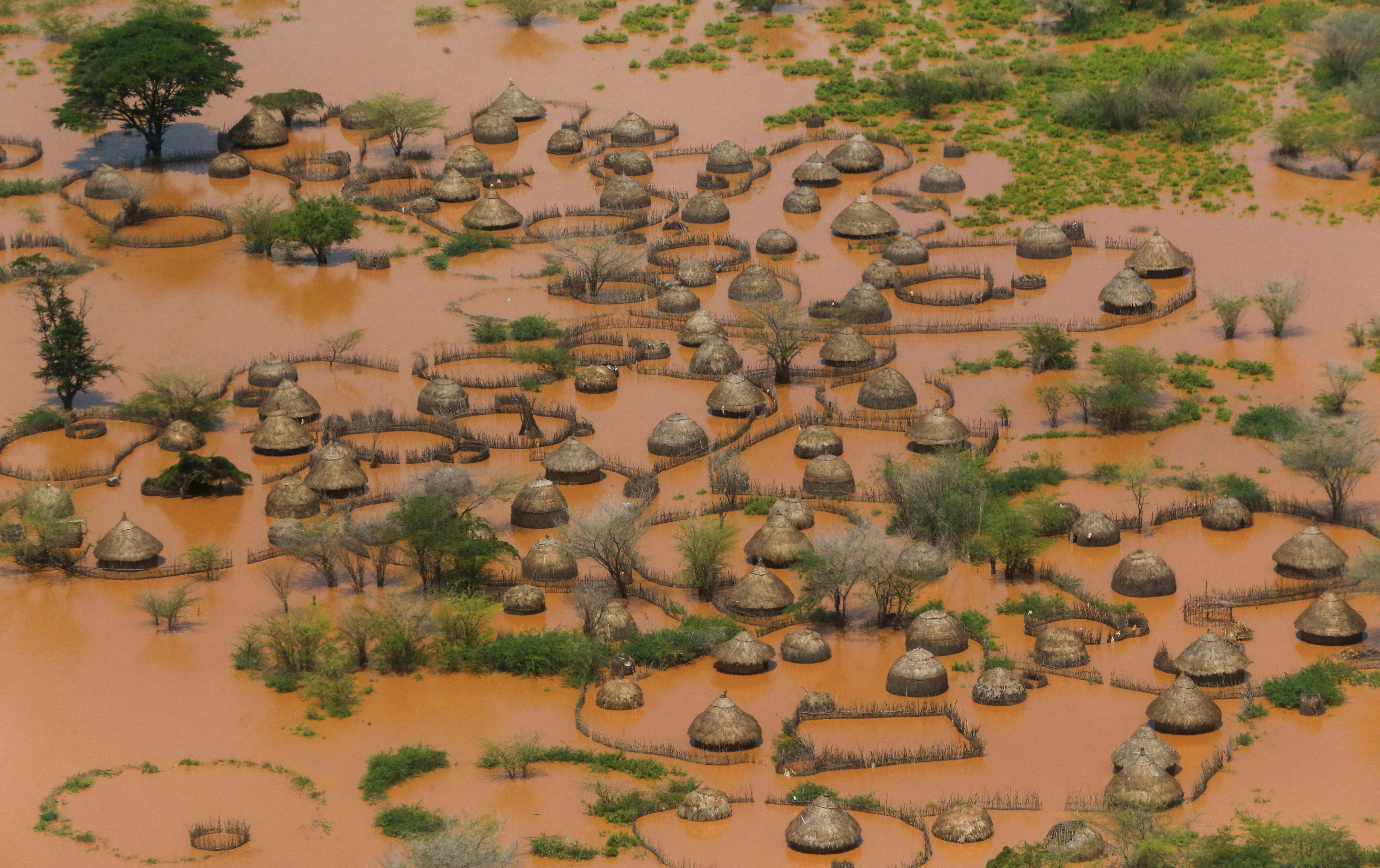 An aerial view shows a deserted and flooded traditional homestead following heavy rains in Garsen