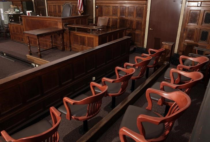 A view of the jury box, the judge's chair, the witness stand and stenographer's desk in court room 422 of the New York Supreme Court at 60 Centre Street
