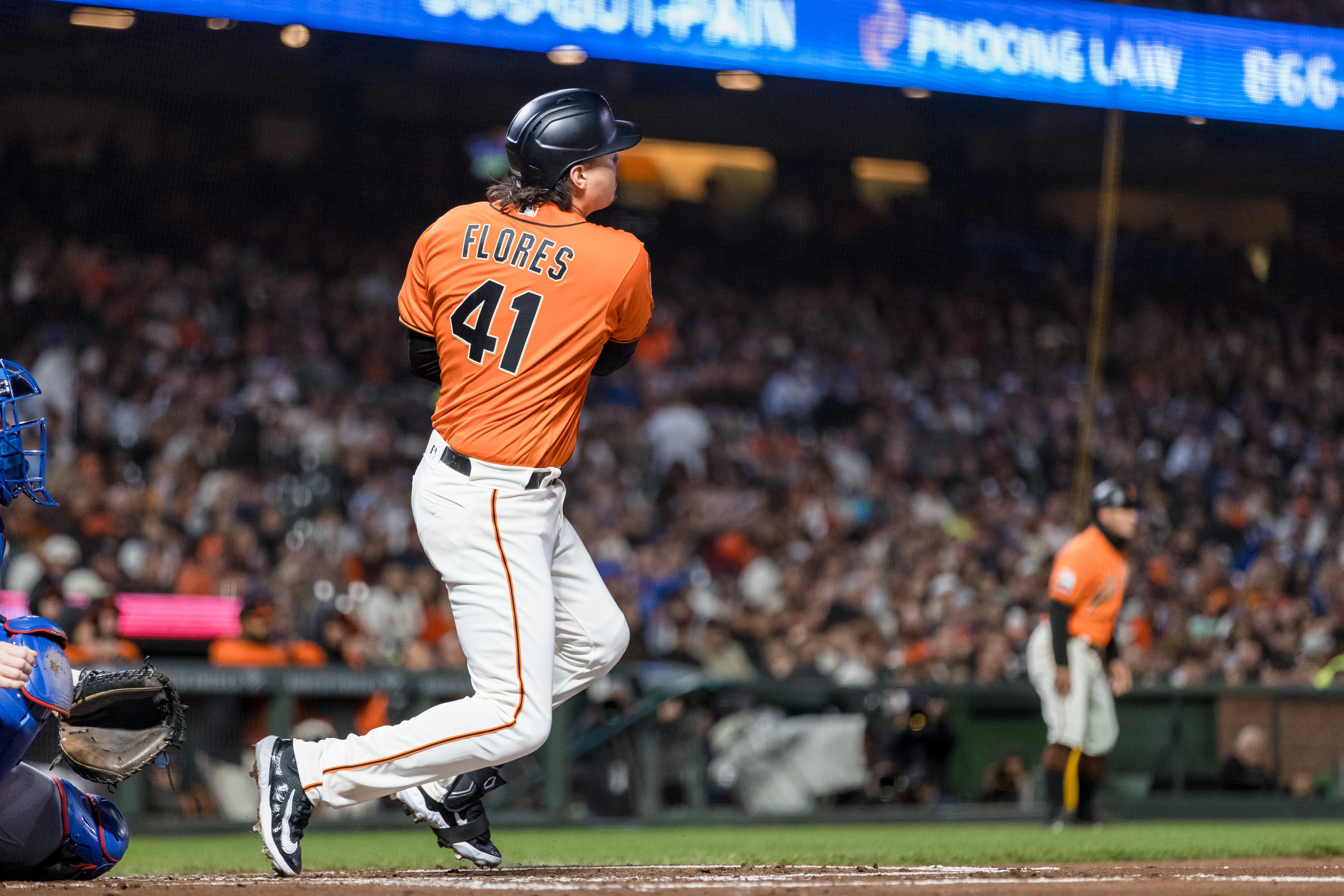 SF Giants' Wilmer Flores homers, exits game vs. Astros