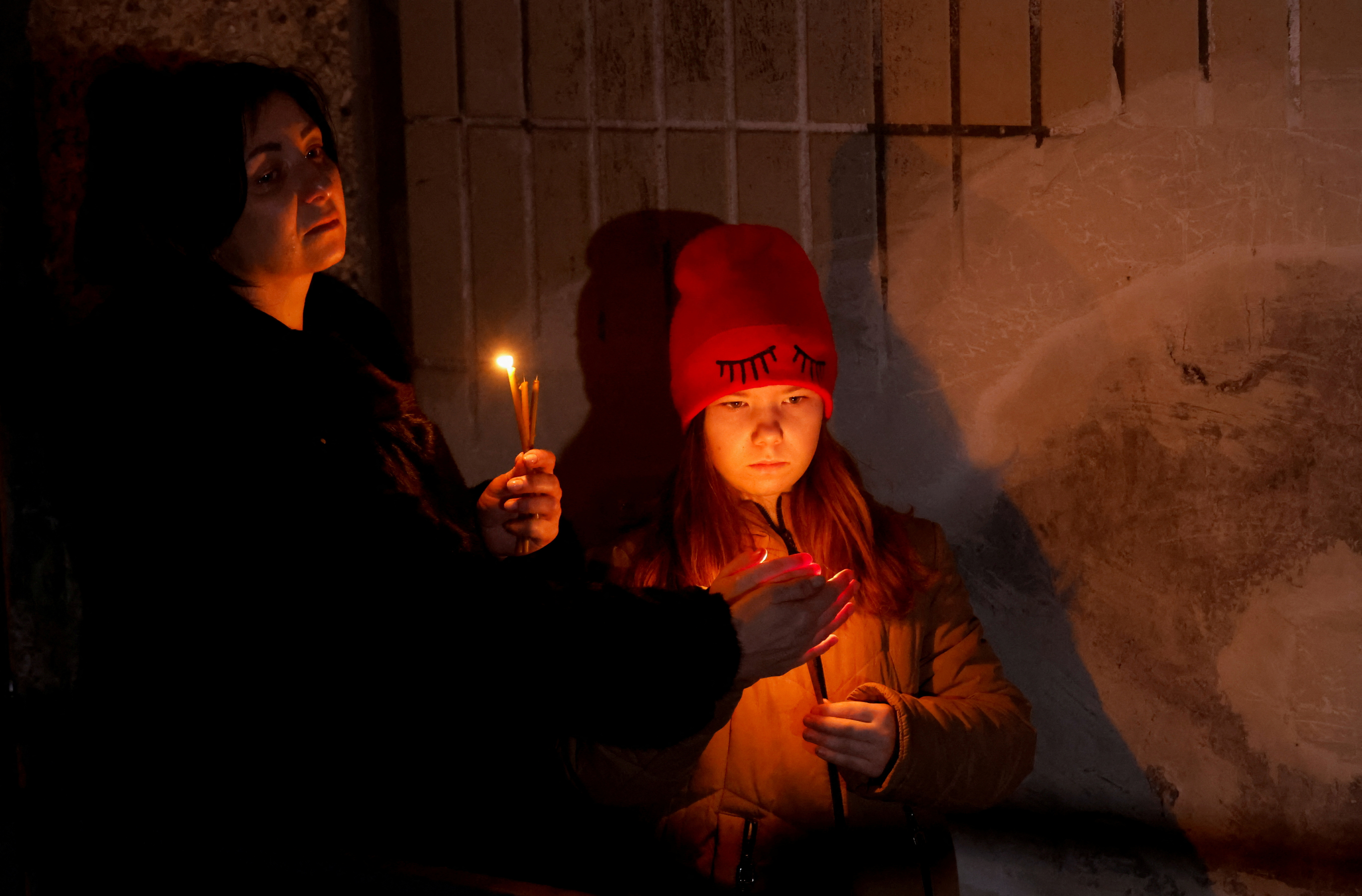People take part in a Ukrainian orthodox vigil in Brovary