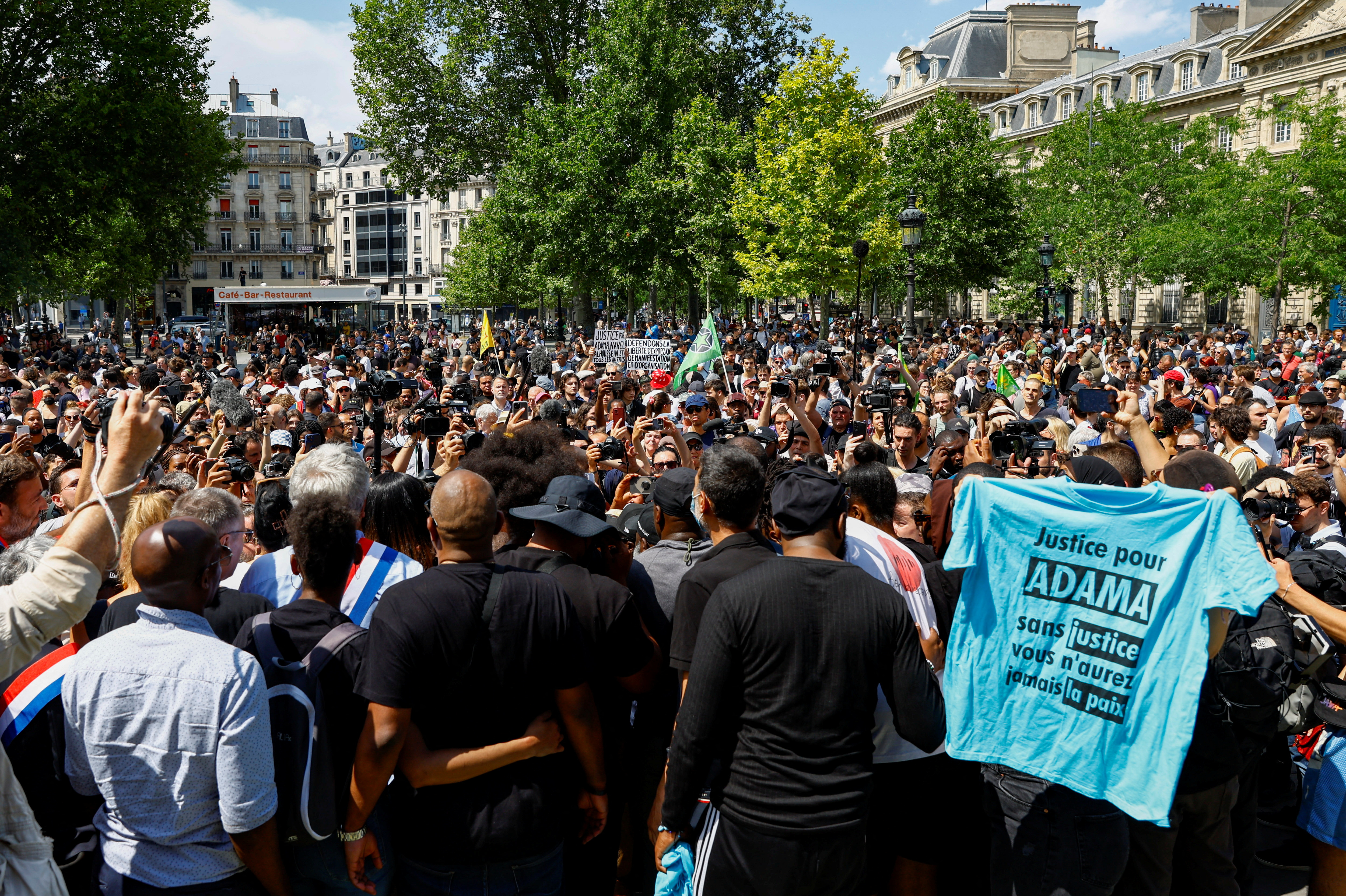 People attend a march in memory of Adama Traore in Paris