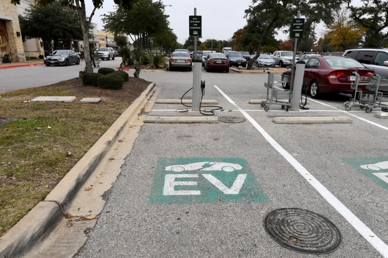 An electric vehicle fast charging station is seen in the parking lot of a Whole Foods Market in Austin
