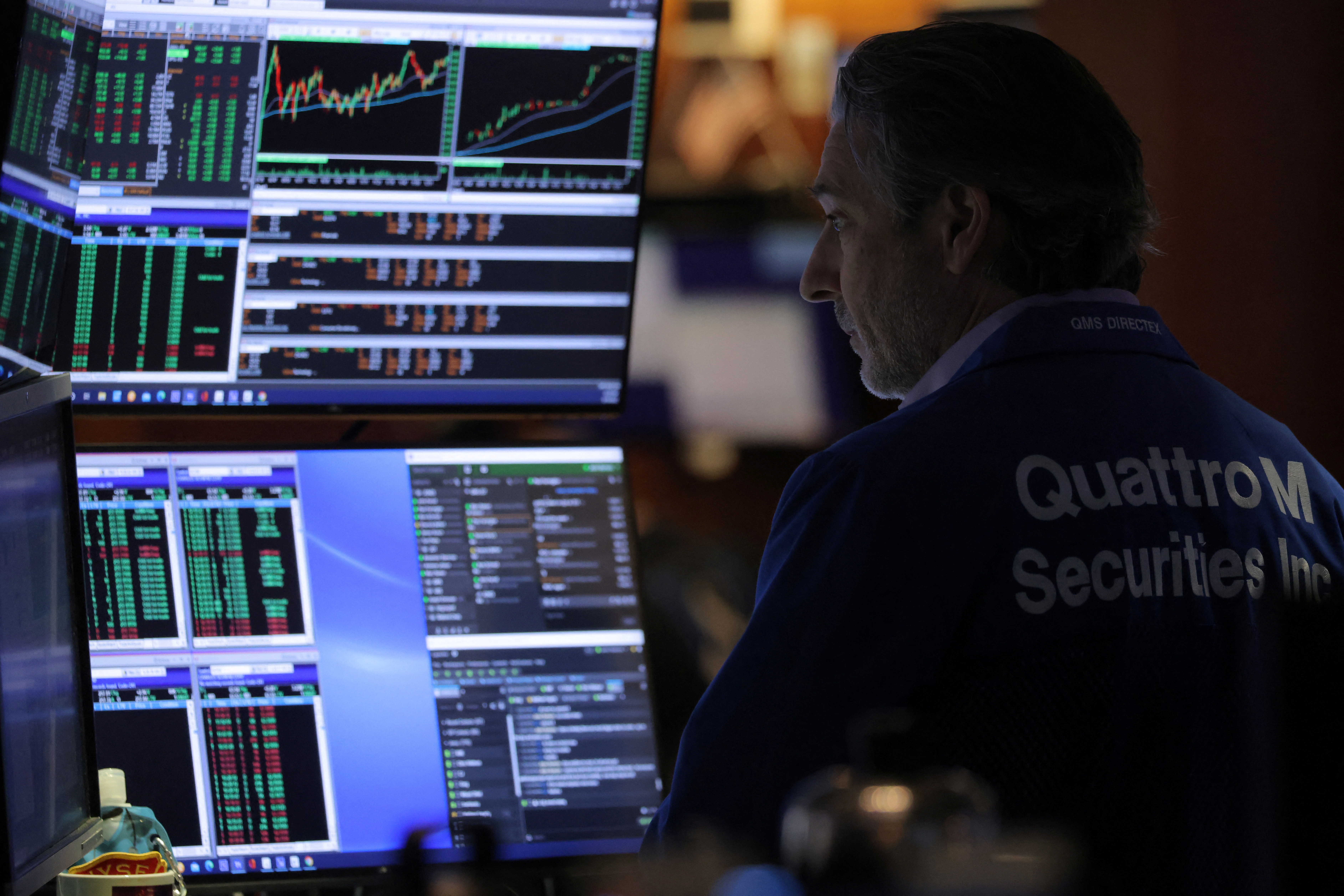 A trader works on the floor of the New York Stock Exchange (NYSE) in Manhattan, New York City