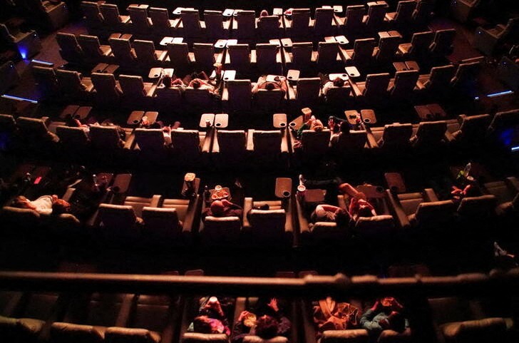 People take their seats inside the Odeon Luxe Leicester Square cinema, on the opening day of the film "Tenet",  in London