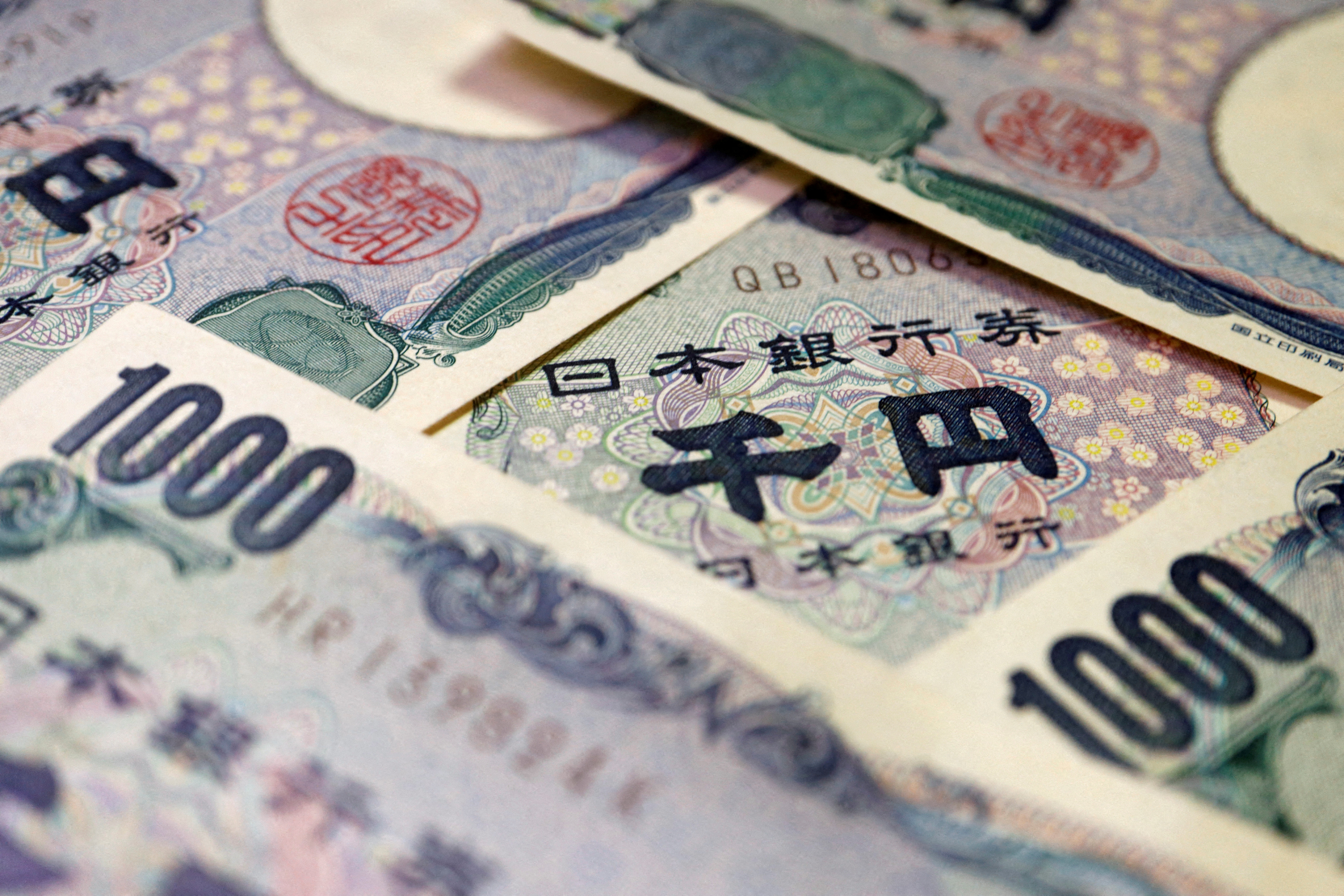 Yen jumps in broad hit to dollar as Japan intervention risks grow | Reuters