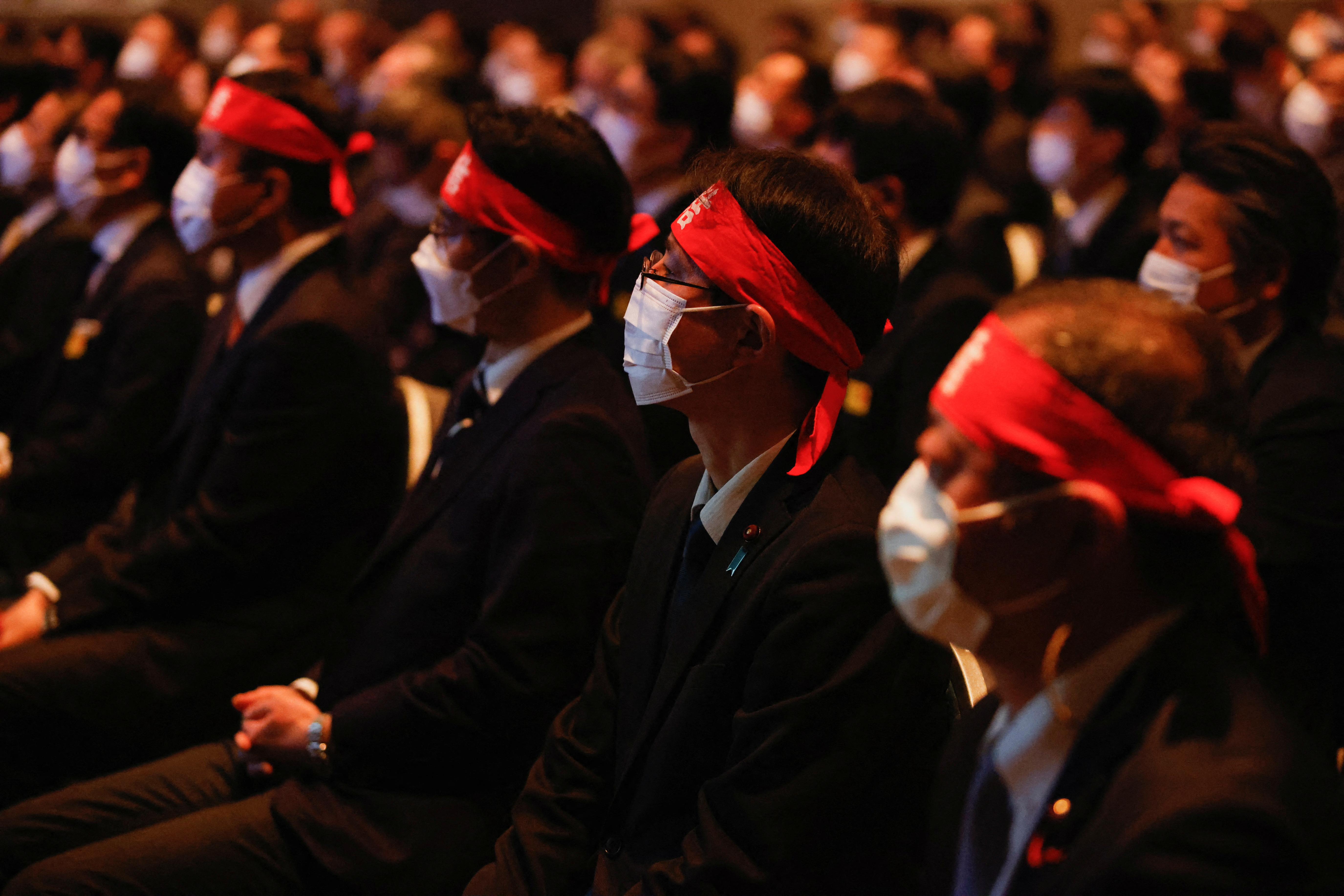 Members of UA Zensen watch a video, during a kick-off rally for the annual "shunto" wage negotiations in Tokyo