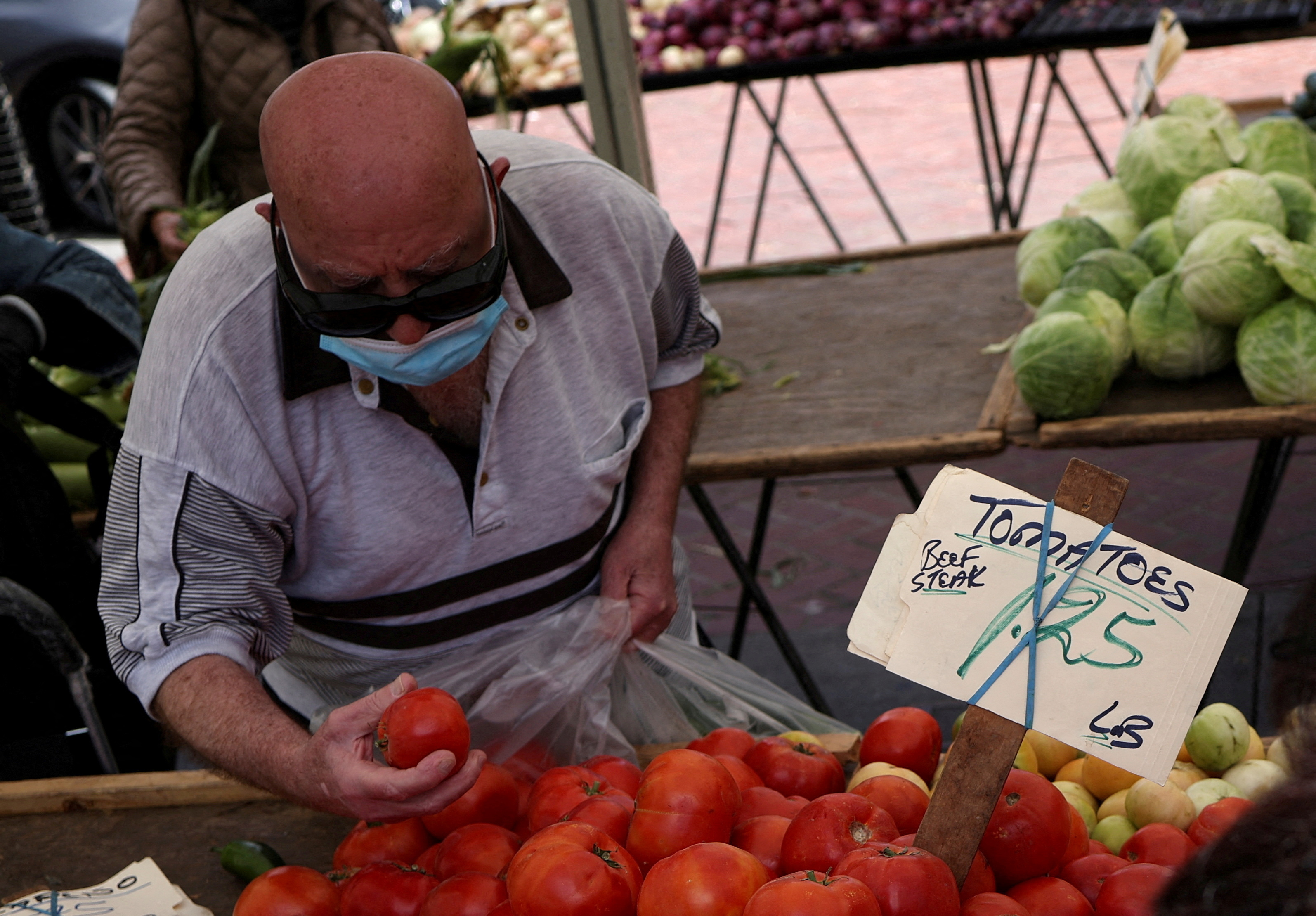 A resident buys food at a local market, in downtown San Francisco, California