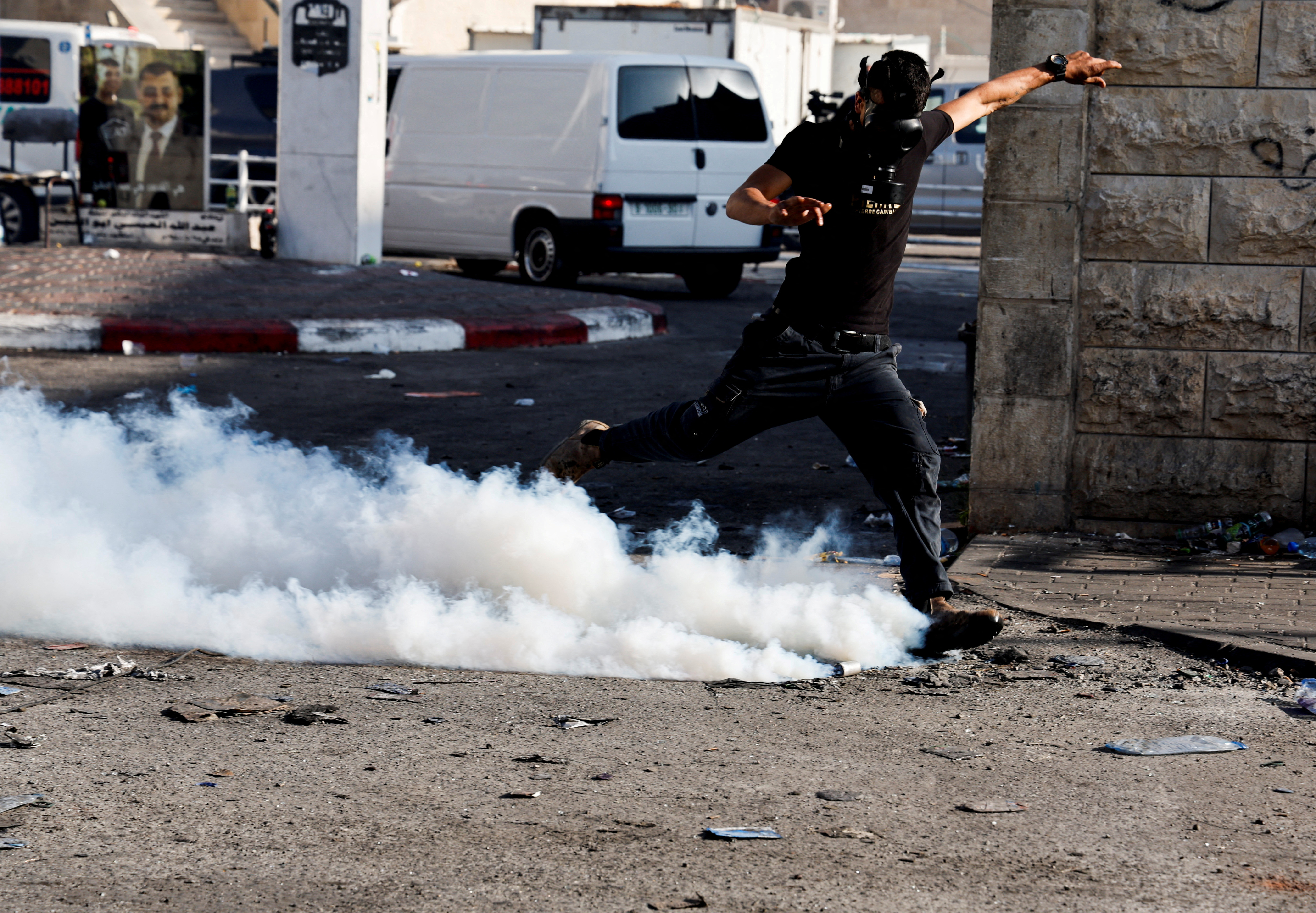 Palestinians clash with Israeli forces during an Israeli military operation in Jenin