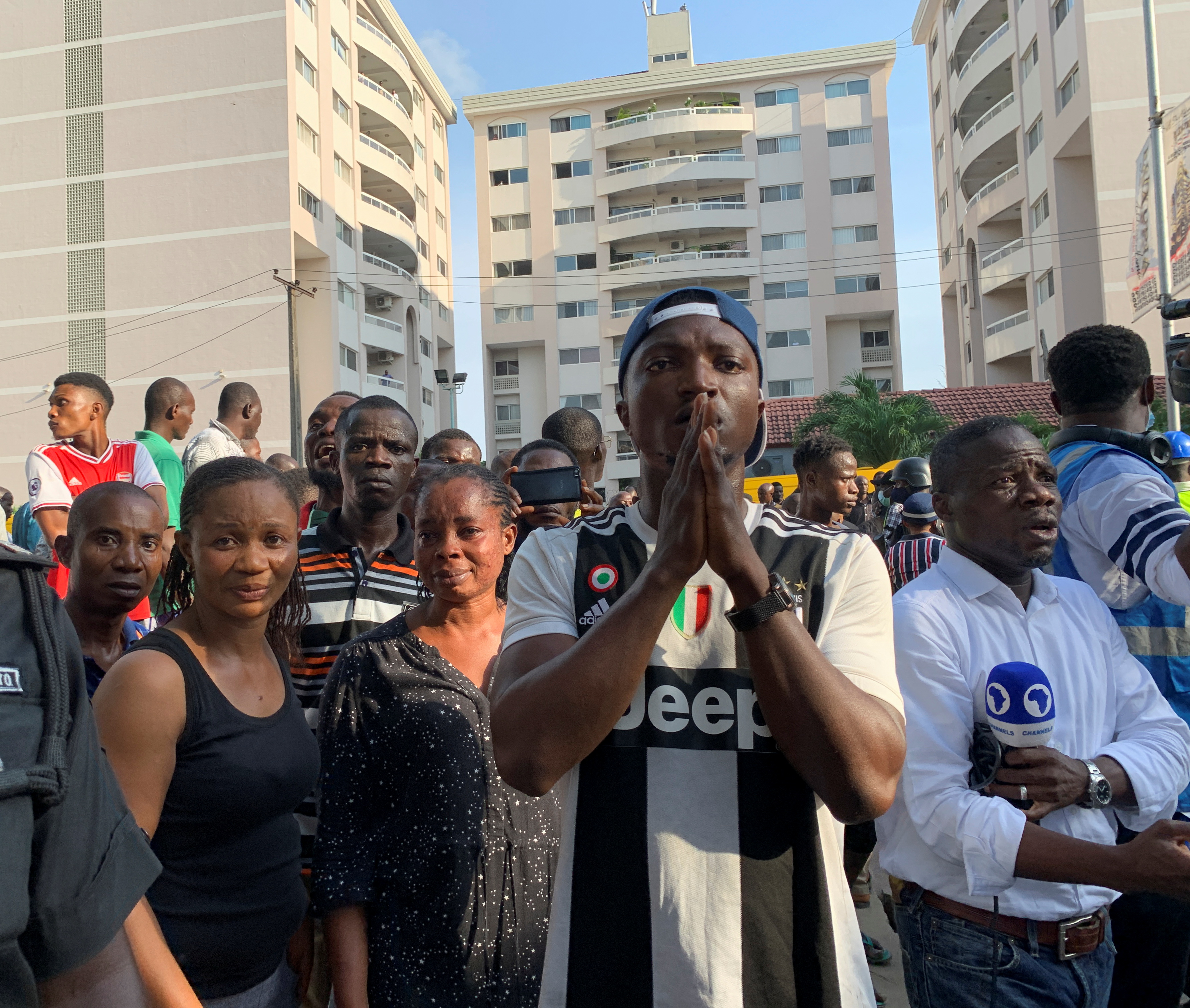 People react as they gather at the site of a collapsed building in Ikoyi, Lagos, Nigeria, November 1, 2021. REUTERS/Temilade Adelaja