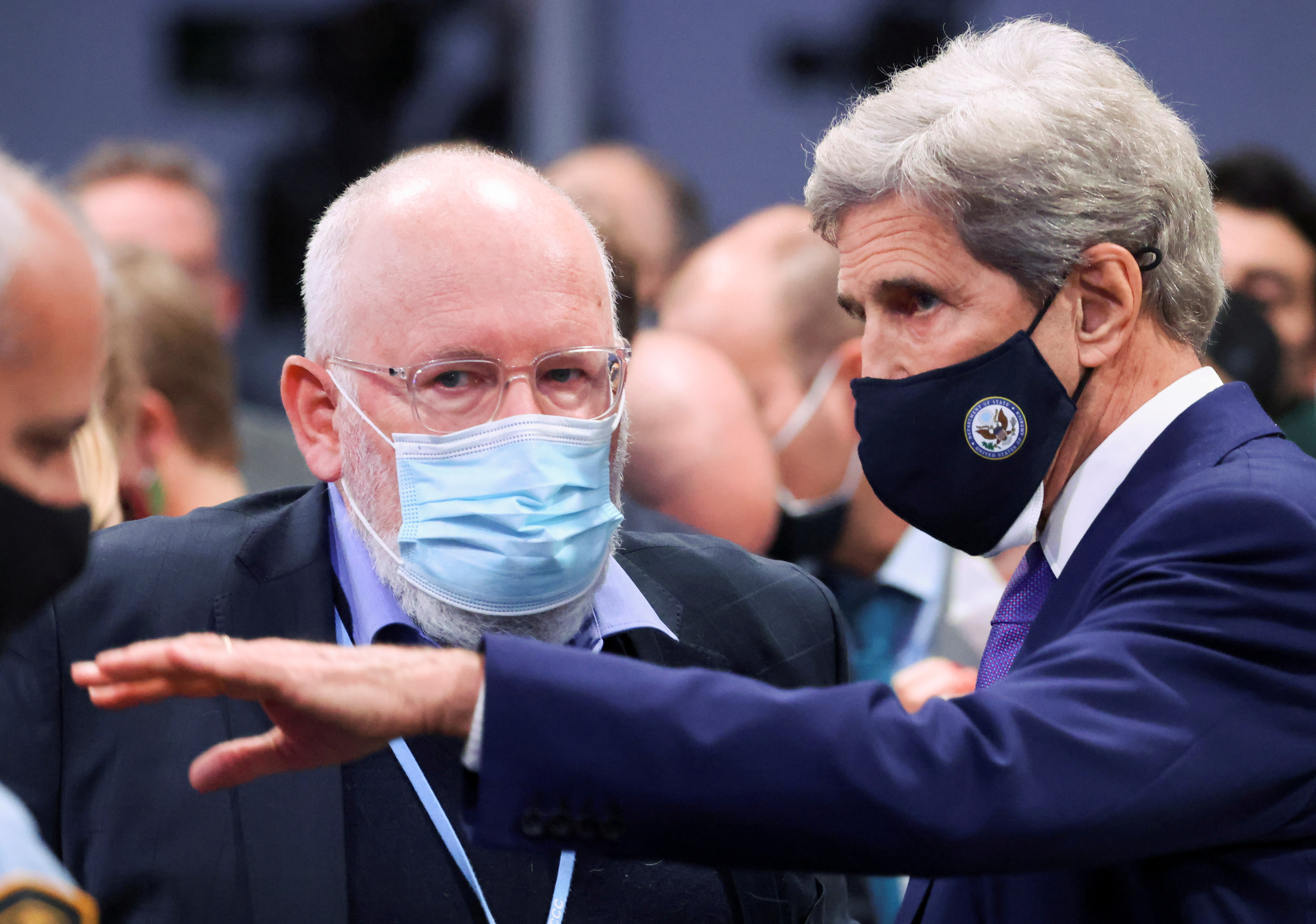 U.S. climate envoy John Kerry talks with European Commission Vice President Frans Timmermans during the UN Climate Change Conference (COP26) in Glasgow, Scotland, Britain November 13, 2021. REUTERS/Yves Herman/File Photo