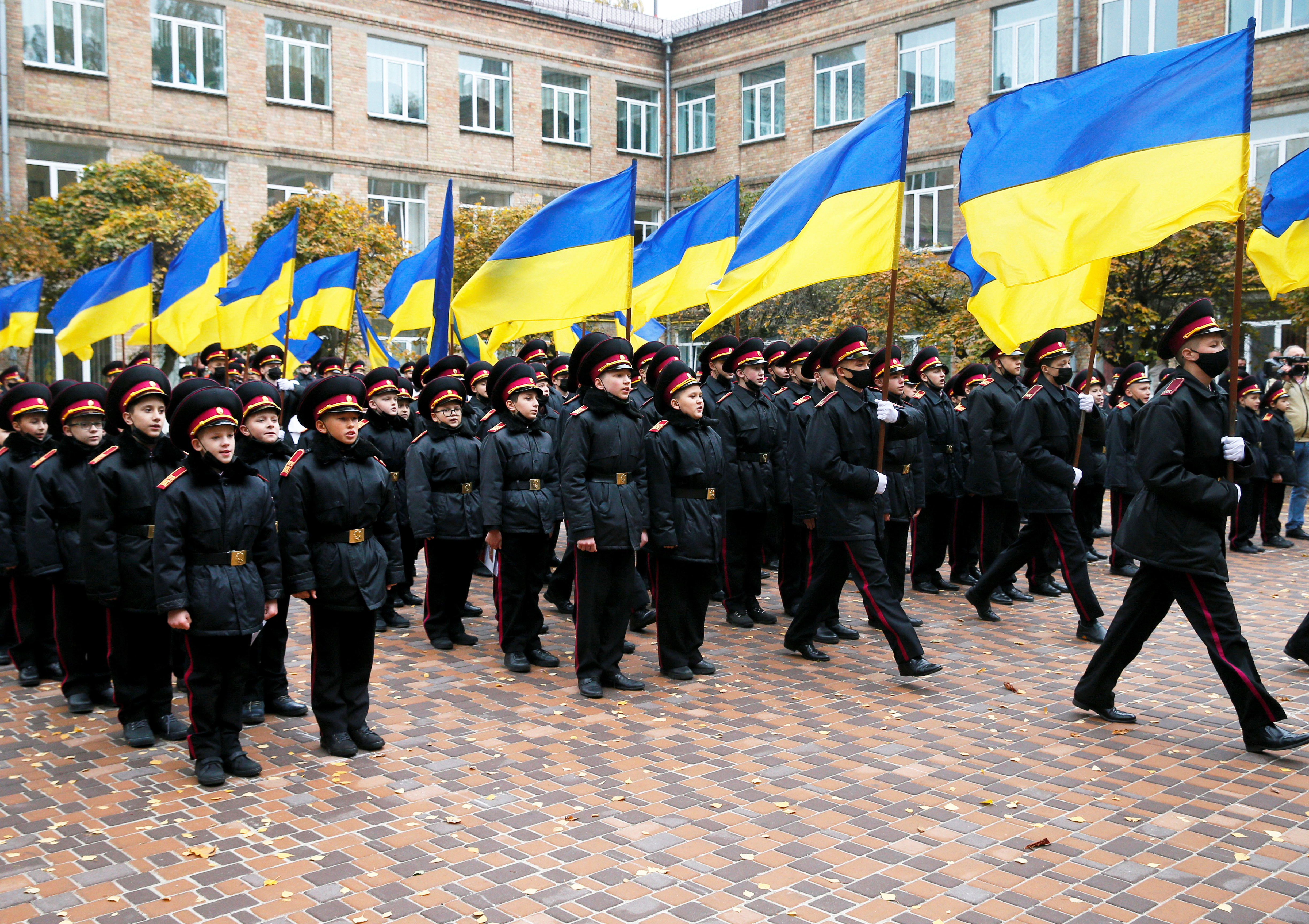 Young military cadets attend a ceremony of presenting shoulder marks in Kyiv
