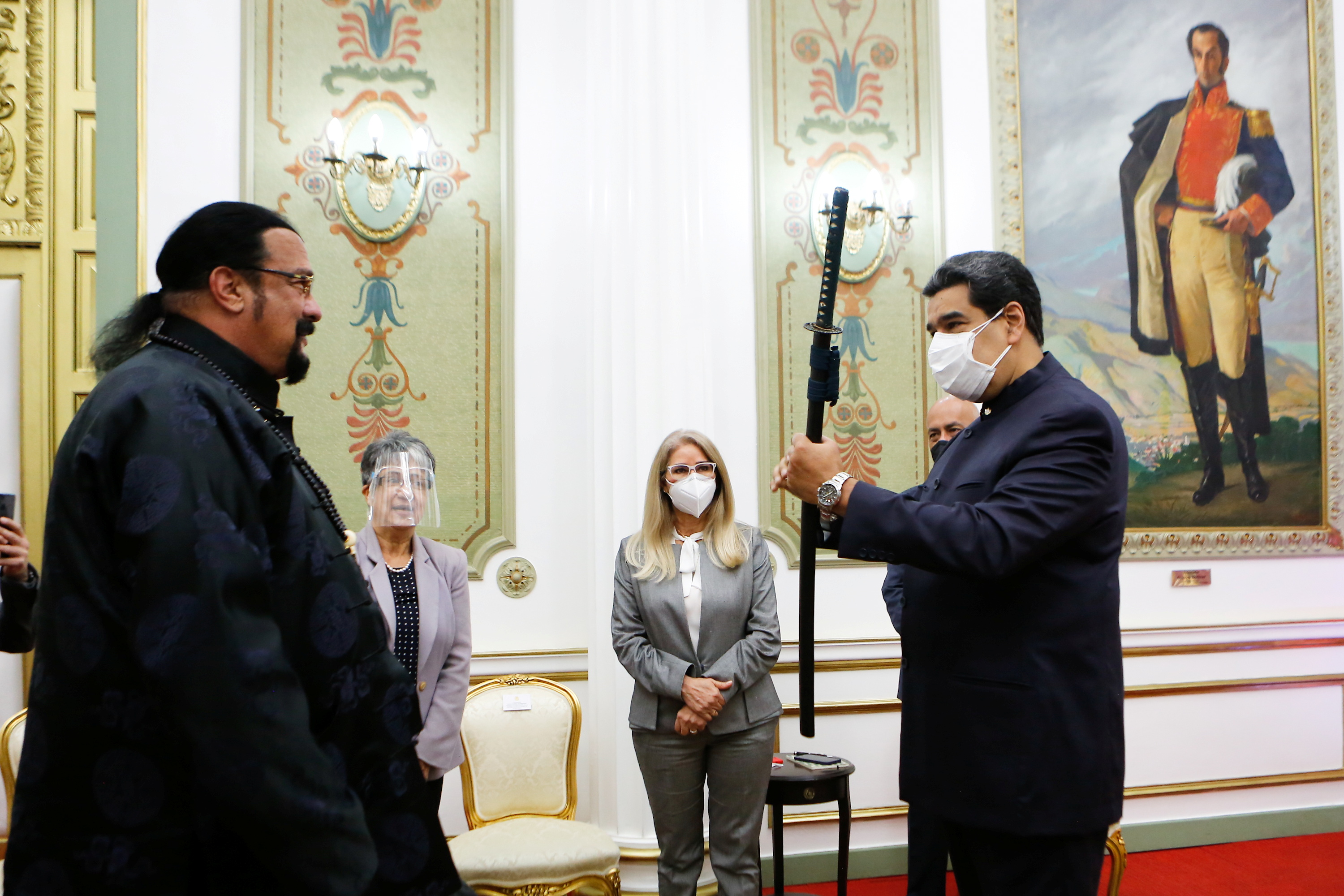 Venezuela's President Nicolas Maduro receives a samurai sword as a gift from actor Steven Seagal, in Caracas