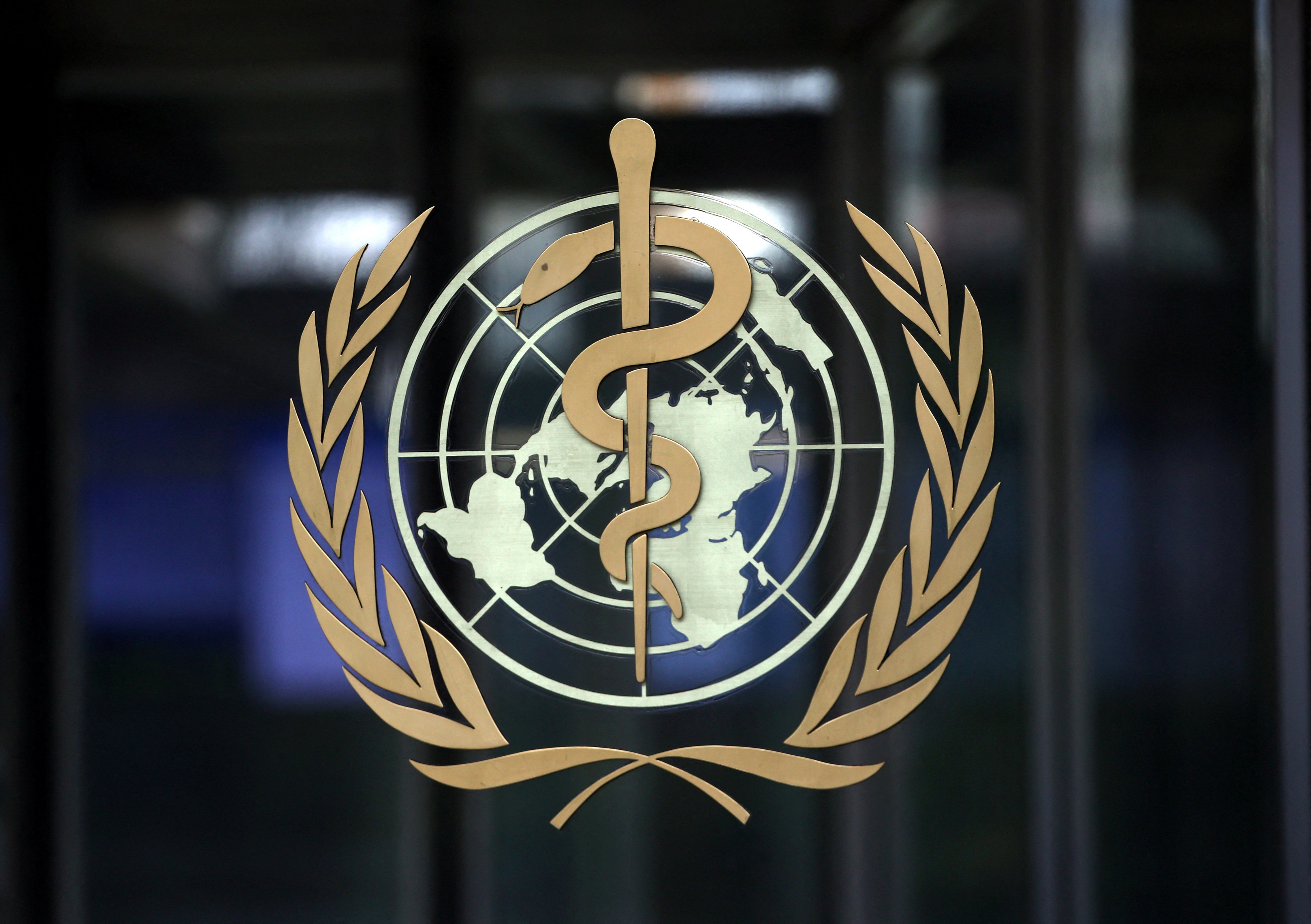A logo is pictured on the headquarters of the WHO in Geneva