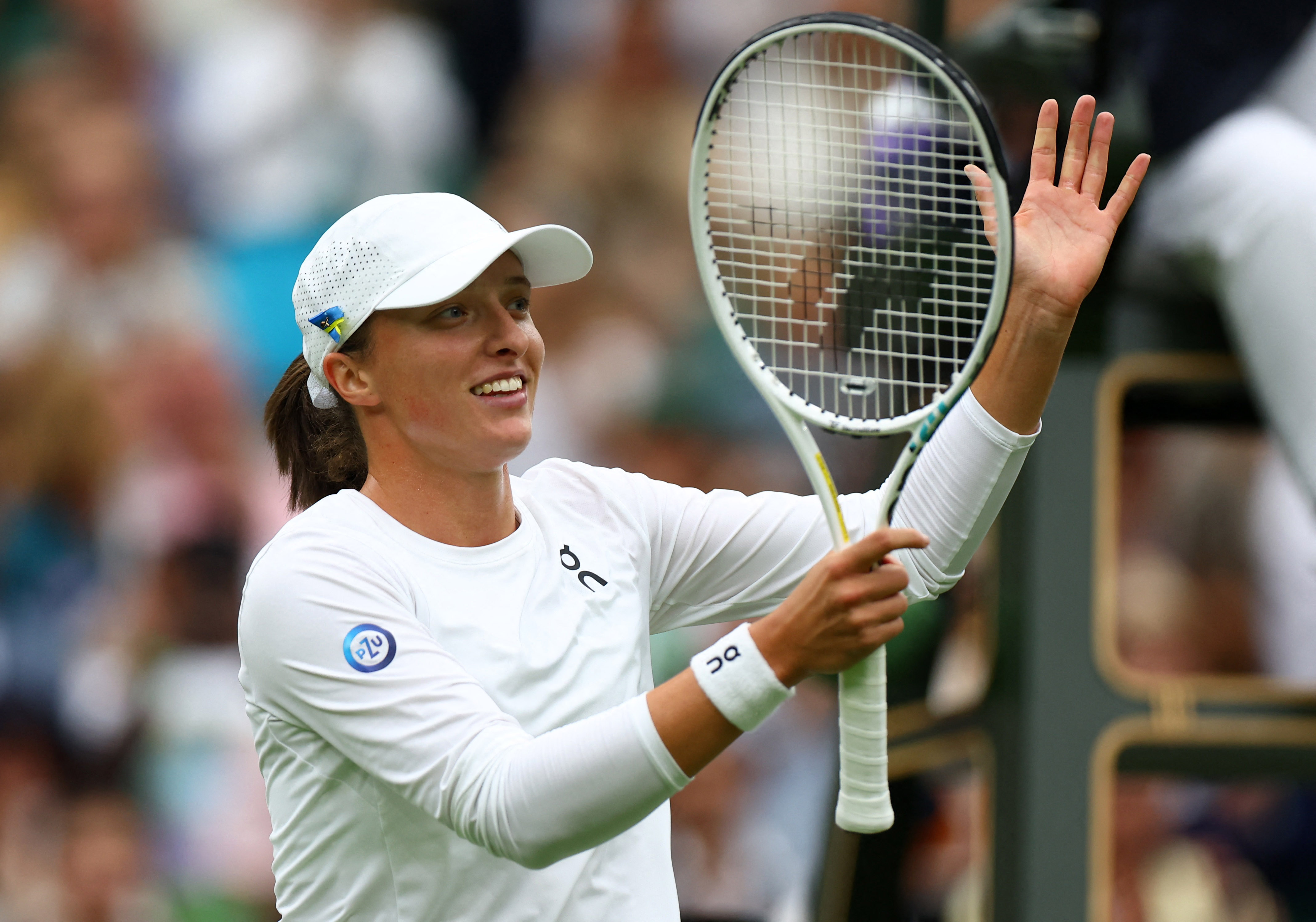 Top seed Swiatek powers past Zhu to launch Wimbledon title quest Reuters