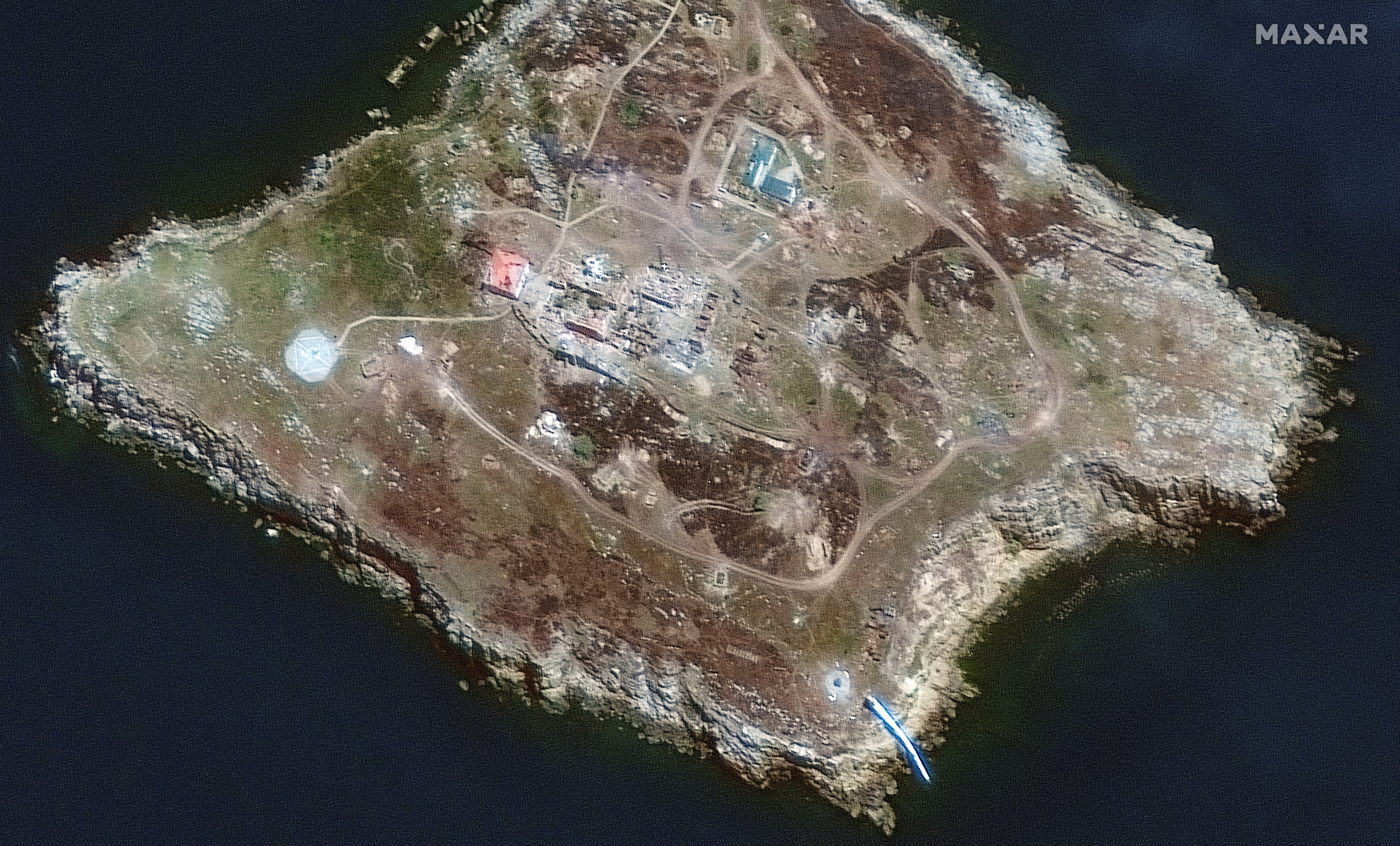 A satellite image shows the southern end of Snake Island