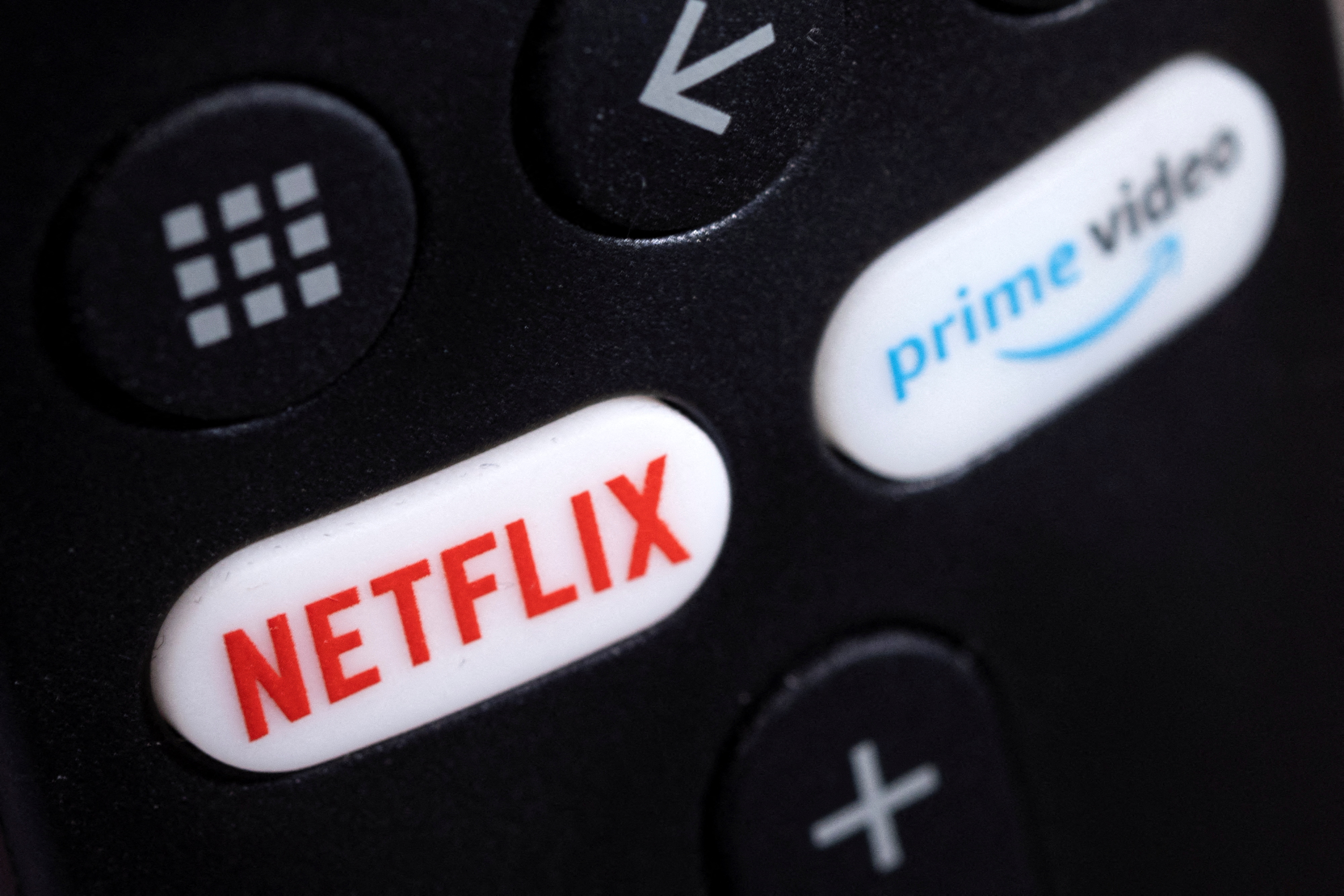 Netflix and Prime video logos are seen on a TV remote controller in this illustration