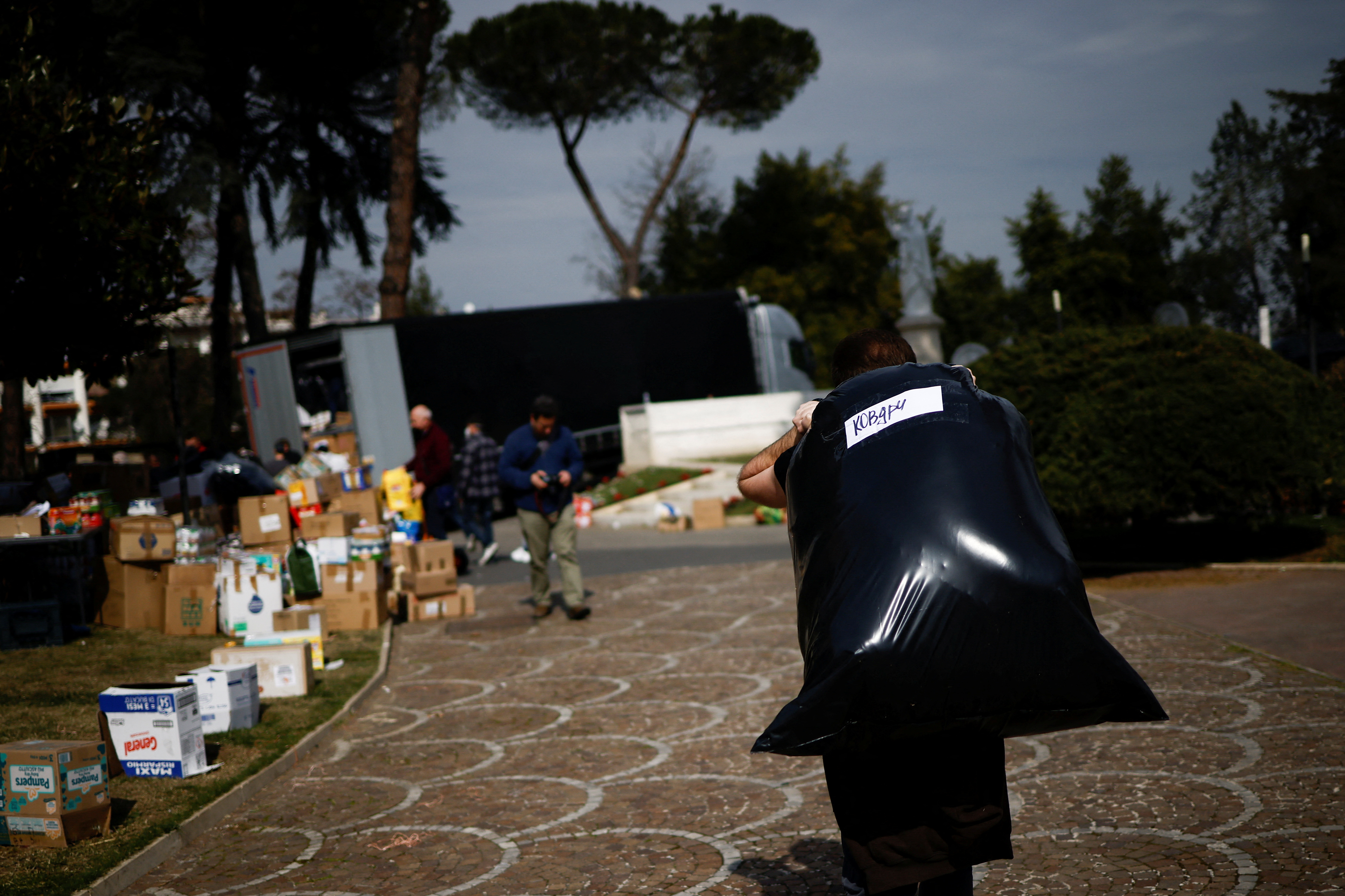Volunteers pack humanitarian goods to be sent to Ukraine, in Rome