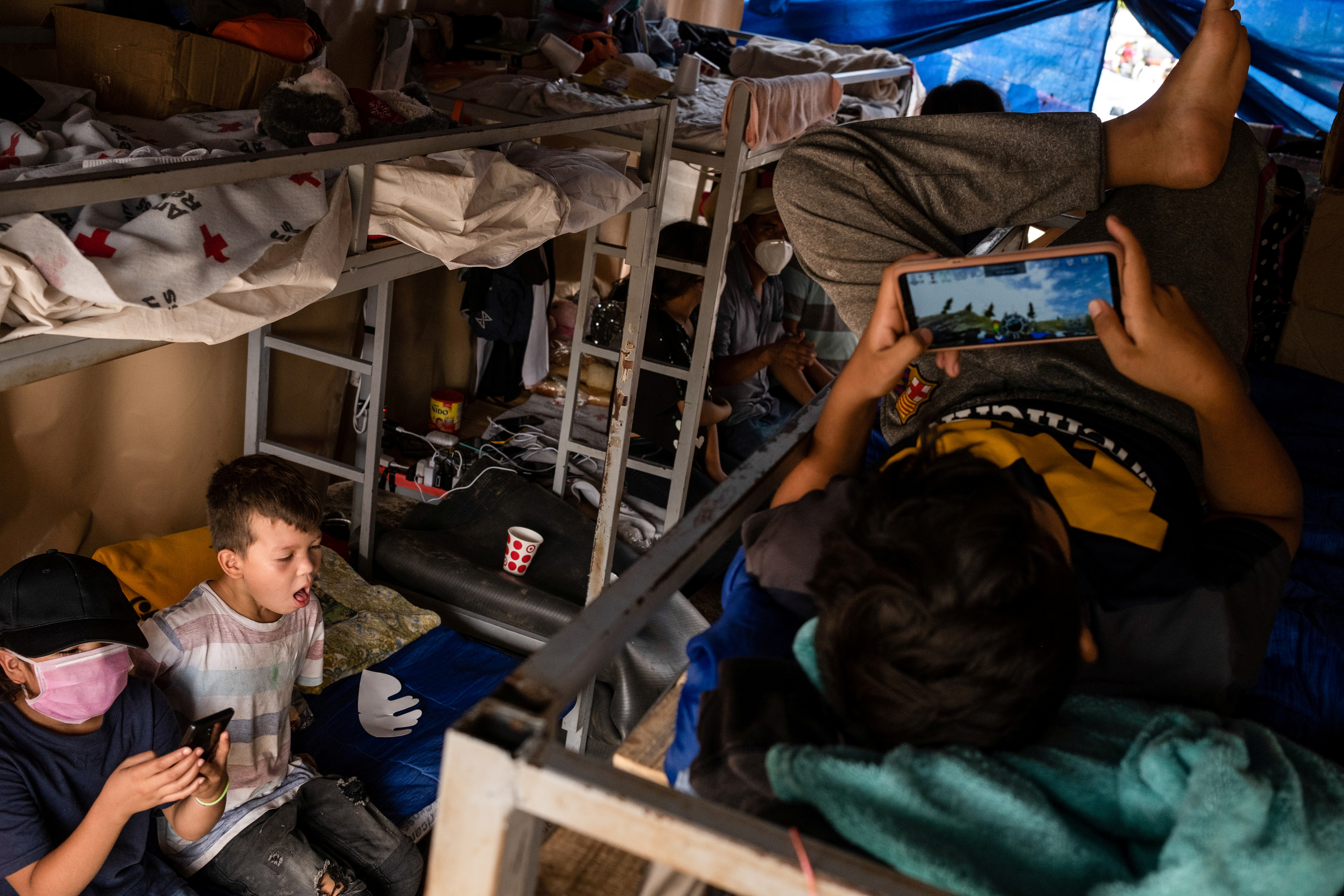Asylum-seeking migrants live in a public square in Reynosa, Mexico