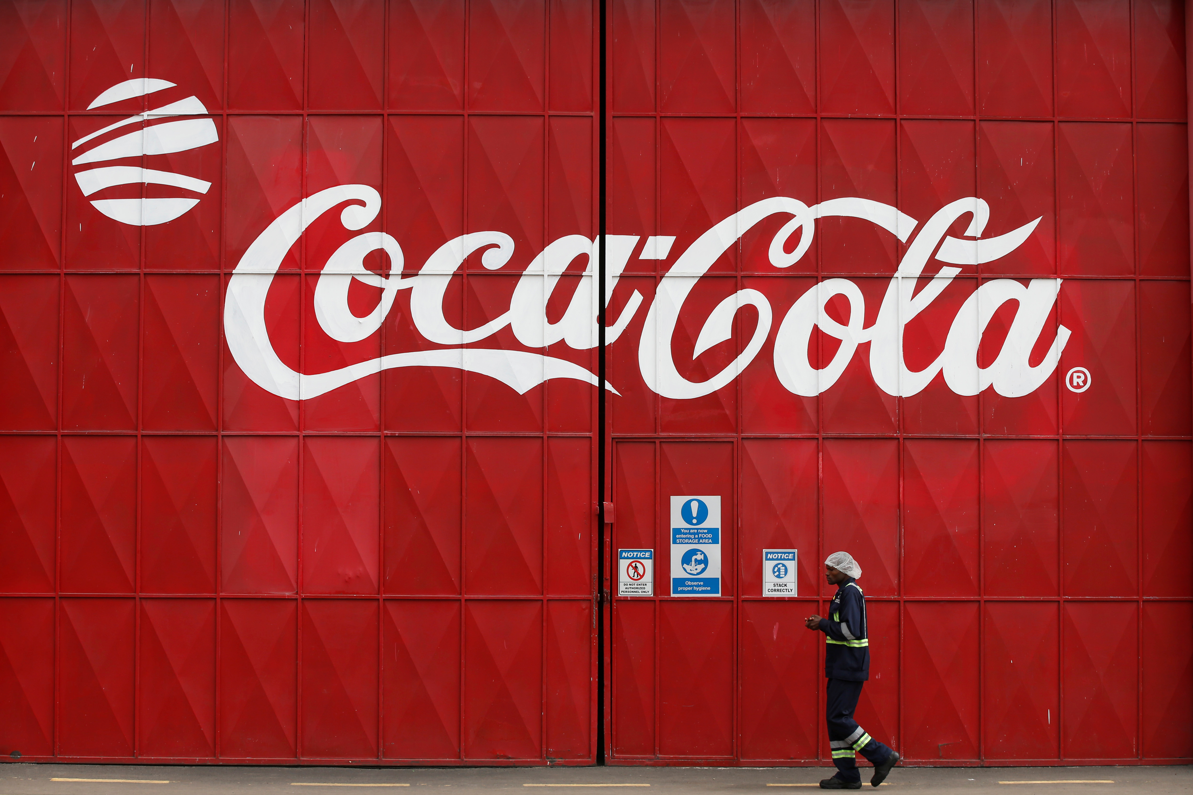 A man walks in the Coca Cola factory in Nairobi