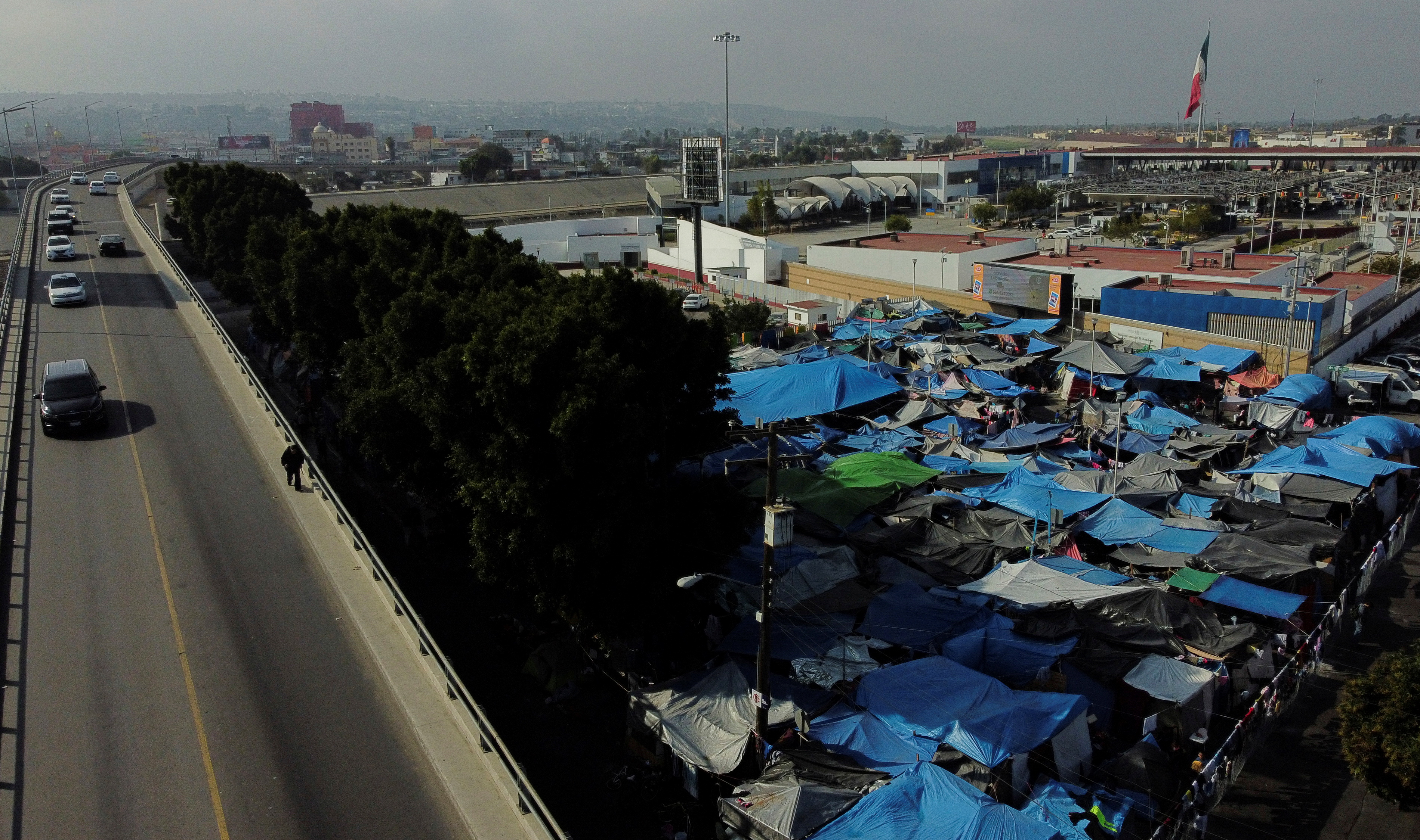 U.S. to restart Trump-era border program forcing asylum seekers to wait in Tijuana