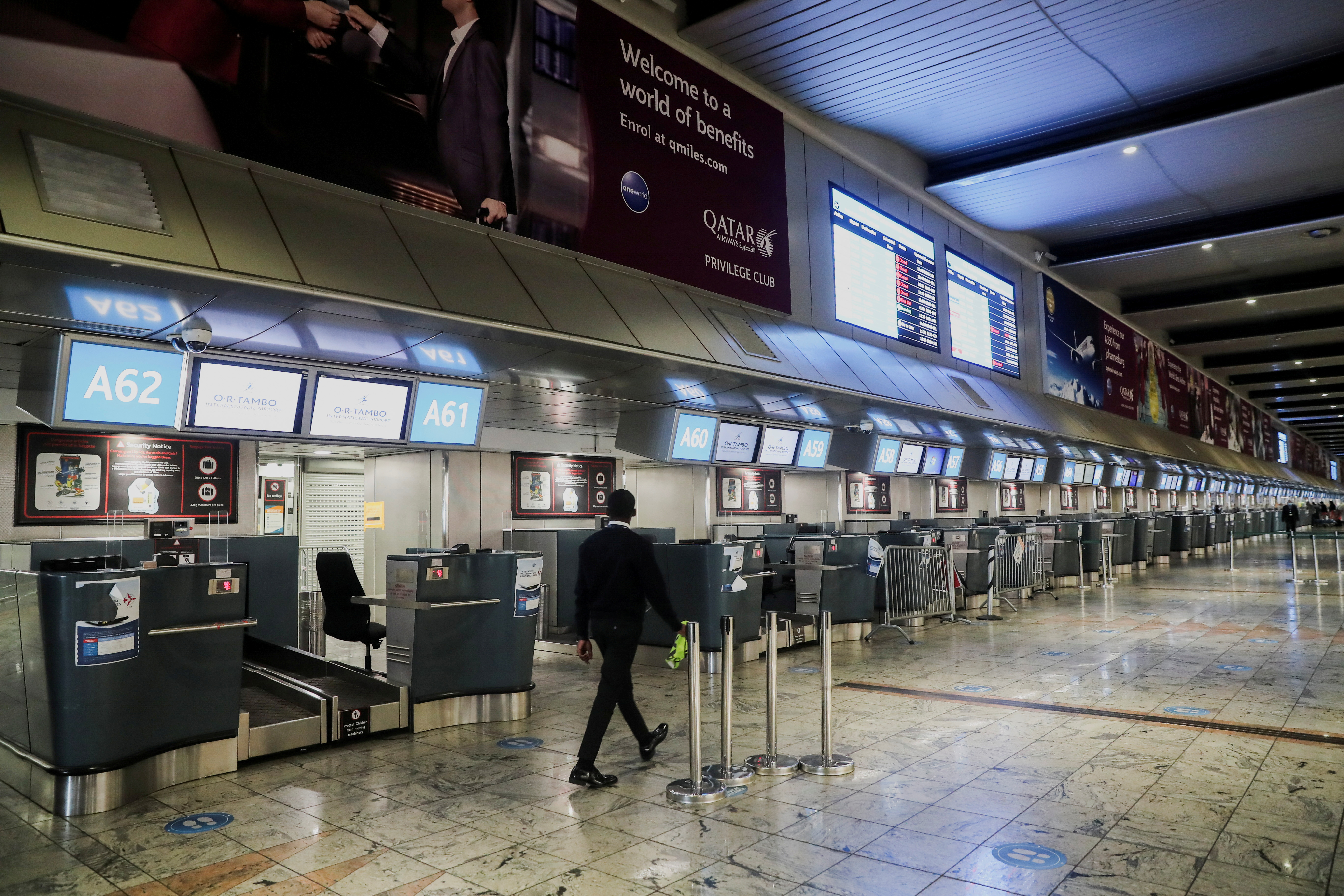 International check-in counters stand empty at O.R. Tambo International Airport after several airlines stopped flying out of South Africa because of the spread of the Omicron coronavirus variant