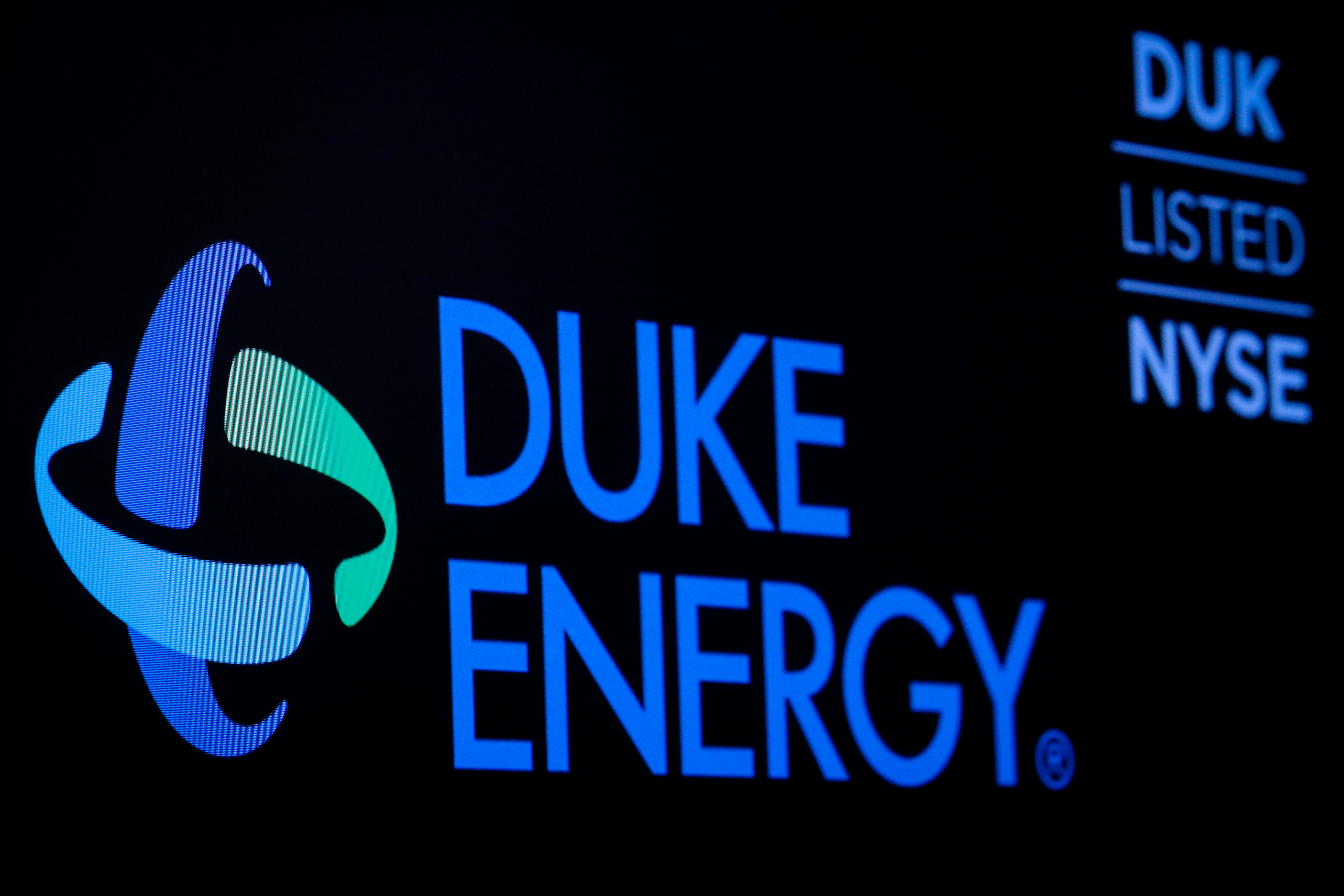 File photo: The company logo and ticker for Duke Energy Corp. is displayed on a screen on the floor of the New York Stock Exchange (NYSE) in New York, U.S., March 4, 2019. REUTERS/Brendan McDermid