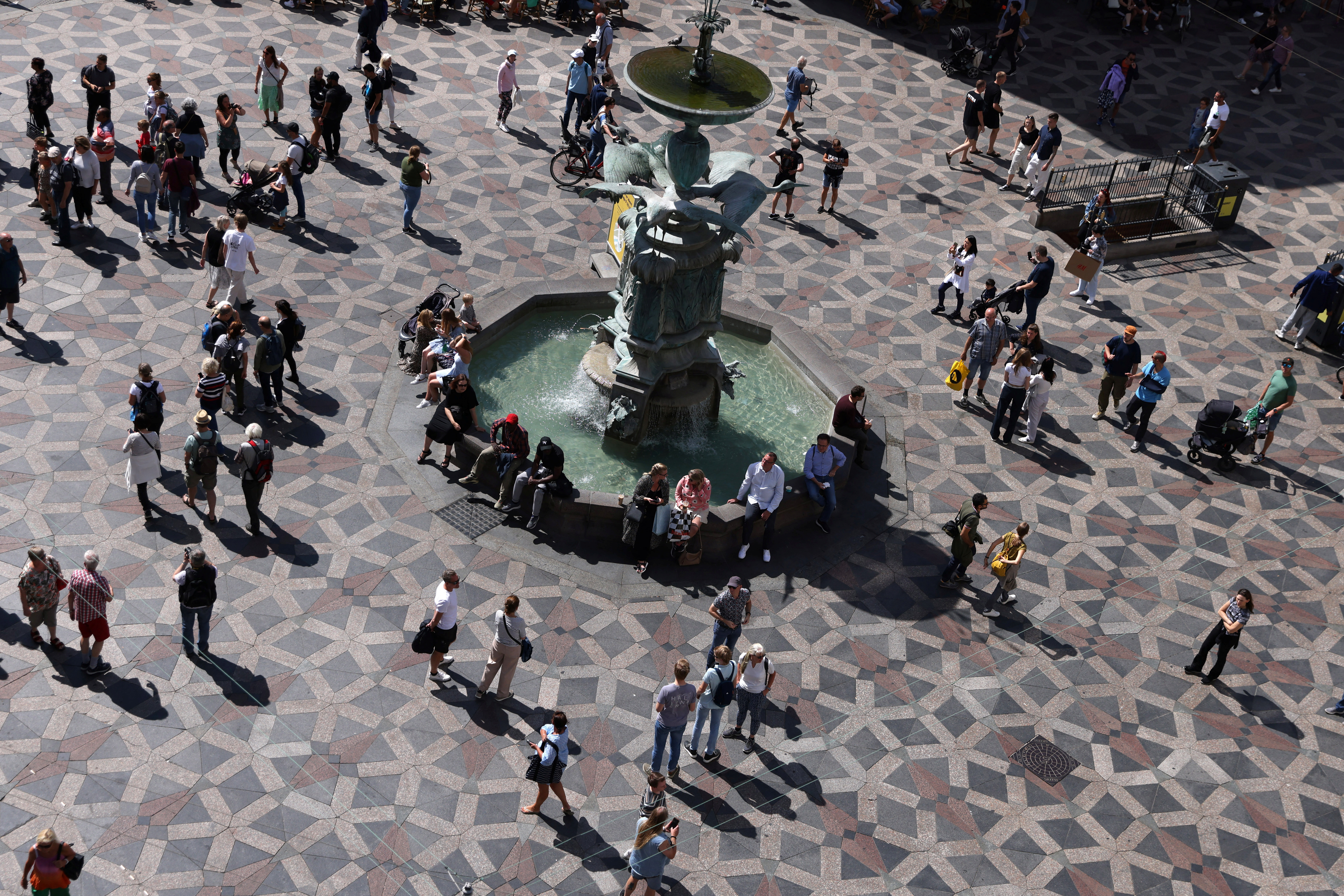 People walk in Amagertorv in Copenhagen