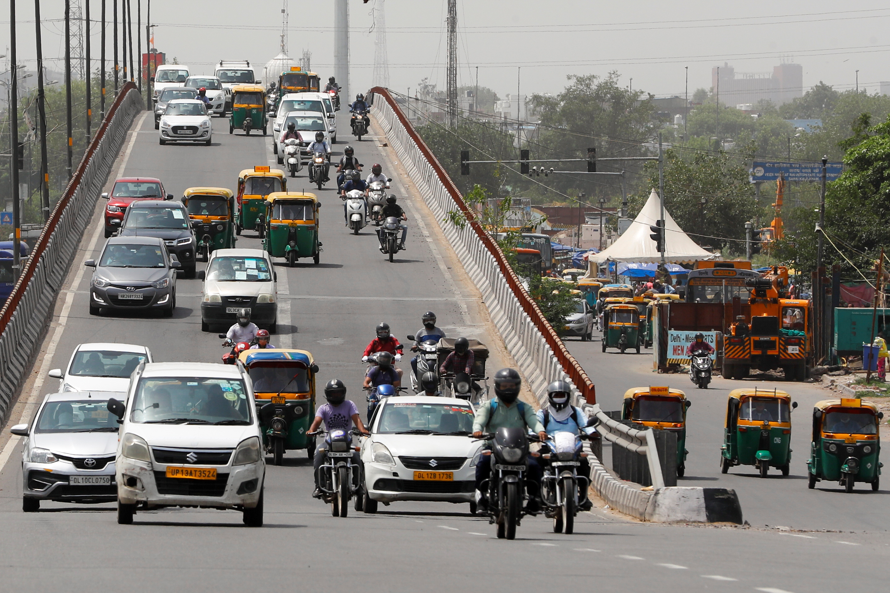 Traffic moves on a flyover, after authorities eased lockdown restrictions that were imposed to slow the spread of the coronavirus disease (COVID-19), in New Delhi, India, June 8, 2021. REUTERS/Adnan Abidi