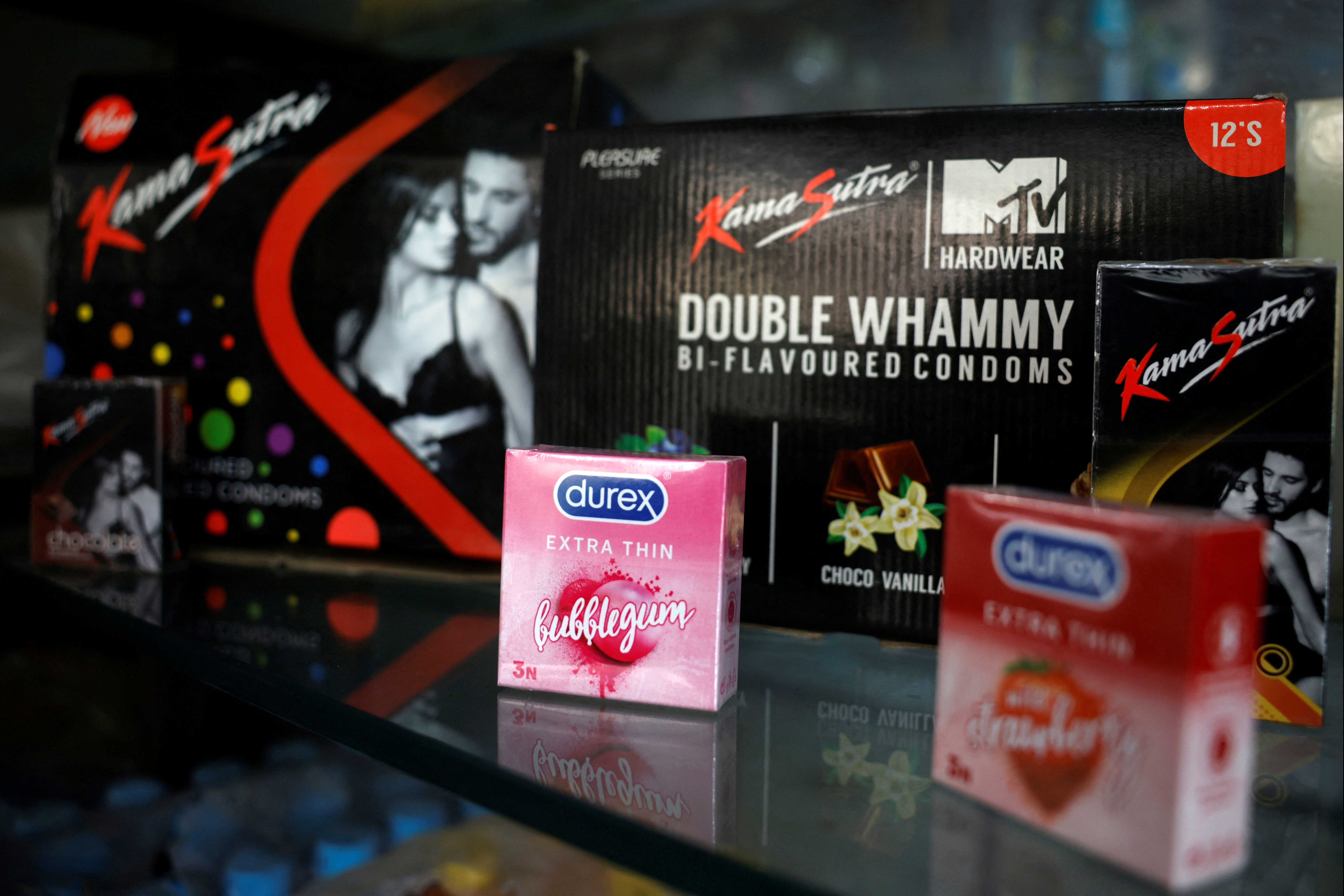 Packets of condoms are displayed for sale at a chemist shop in Ahmedabad