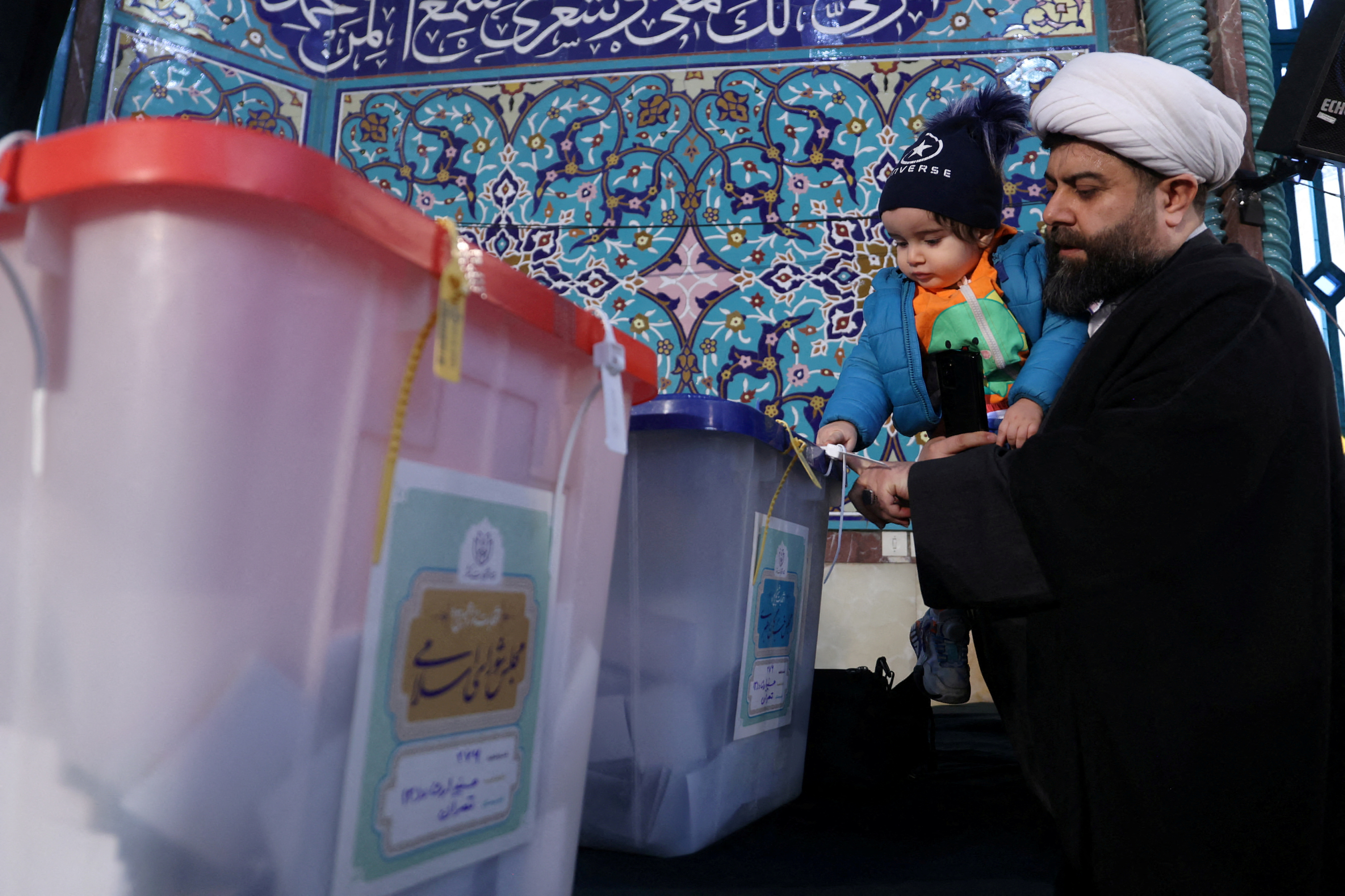 Iranians vote during parliamentary elections at a polling station in Tehran