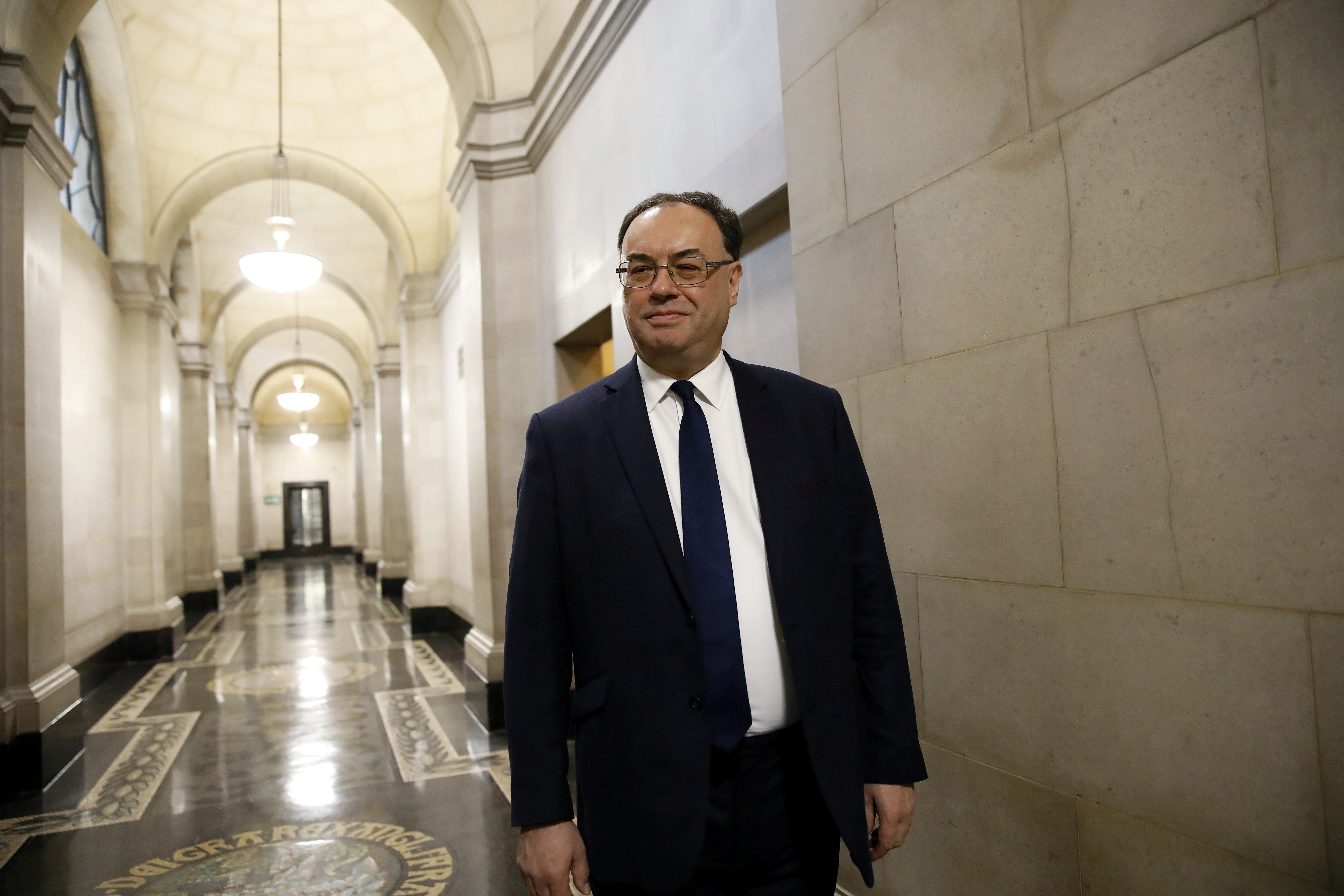 Bank of England Governor Andrew Bailey poses for a photograph on the first day of his new role at the Central Bank in London, Britain March 16, 2020. Tolga Akmen/Pool via REUTERS/File Photo