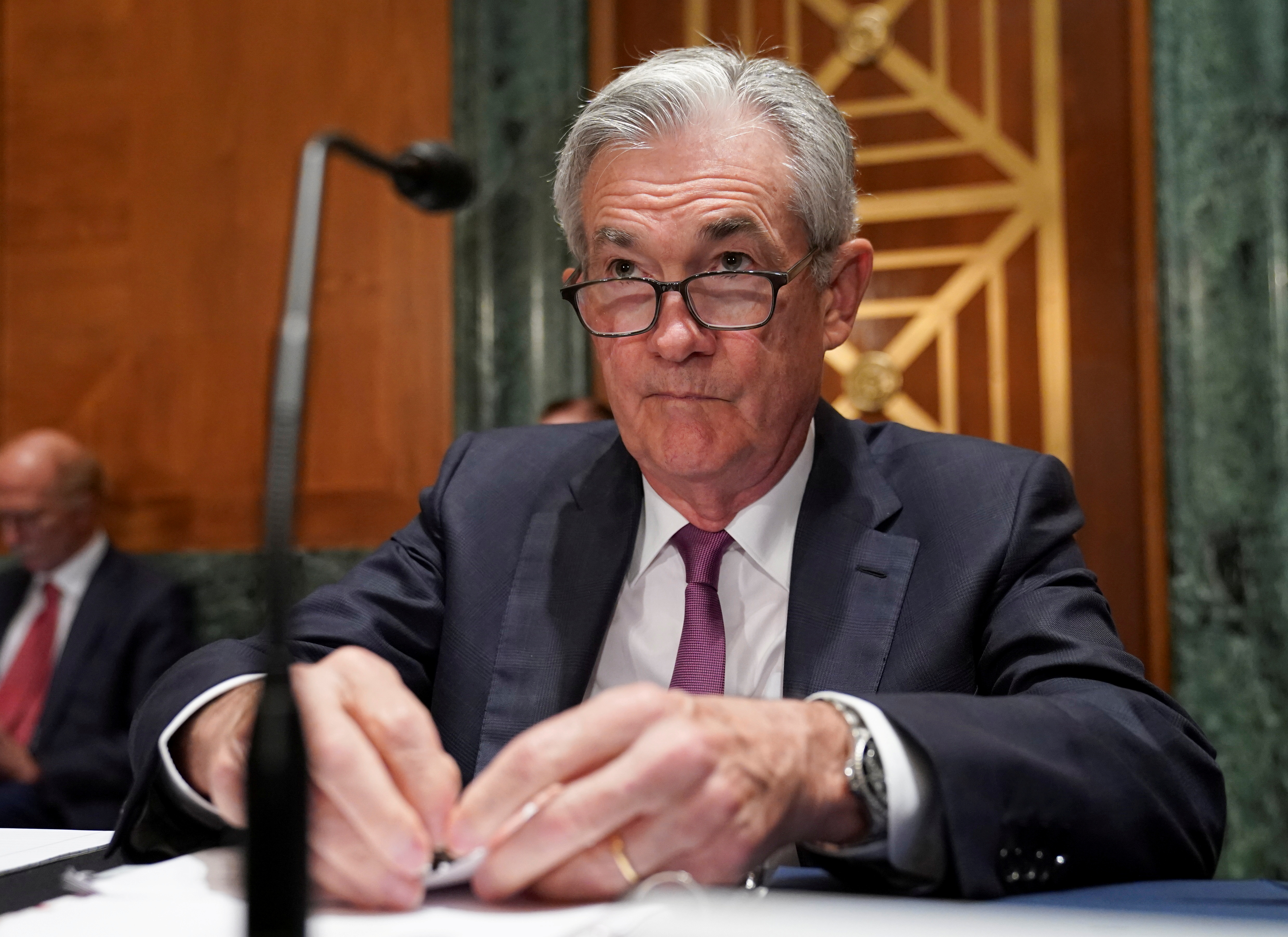 Federal Reserve Chairman Jerome Powell takes his seat to testify before a Senate Banking, Housing and Urban Affairs Committee hearing on “The Semiannual Monetary Policy Report to the Congress” on Capitol Hill in Washington, U.S., July 15, 2021. REUTERS/Kevin Lamarque/File Photo