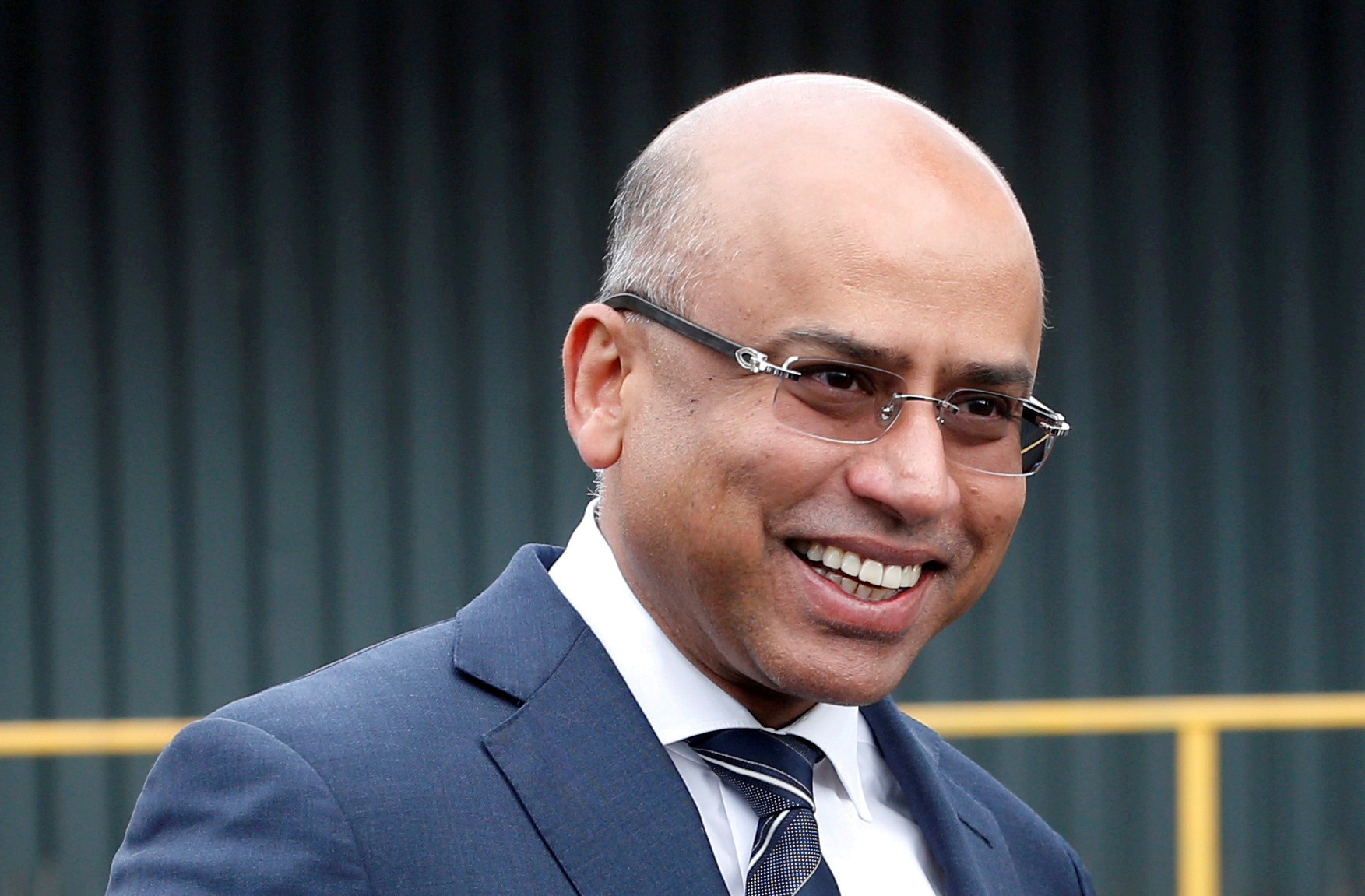 Liberty Steel's Sanjeev Gupta smiles outside the company's Liberty Steel processing mill in Dalzell, Scotland, Britain April 8, 2016. REUTERS/Russell Cheyne