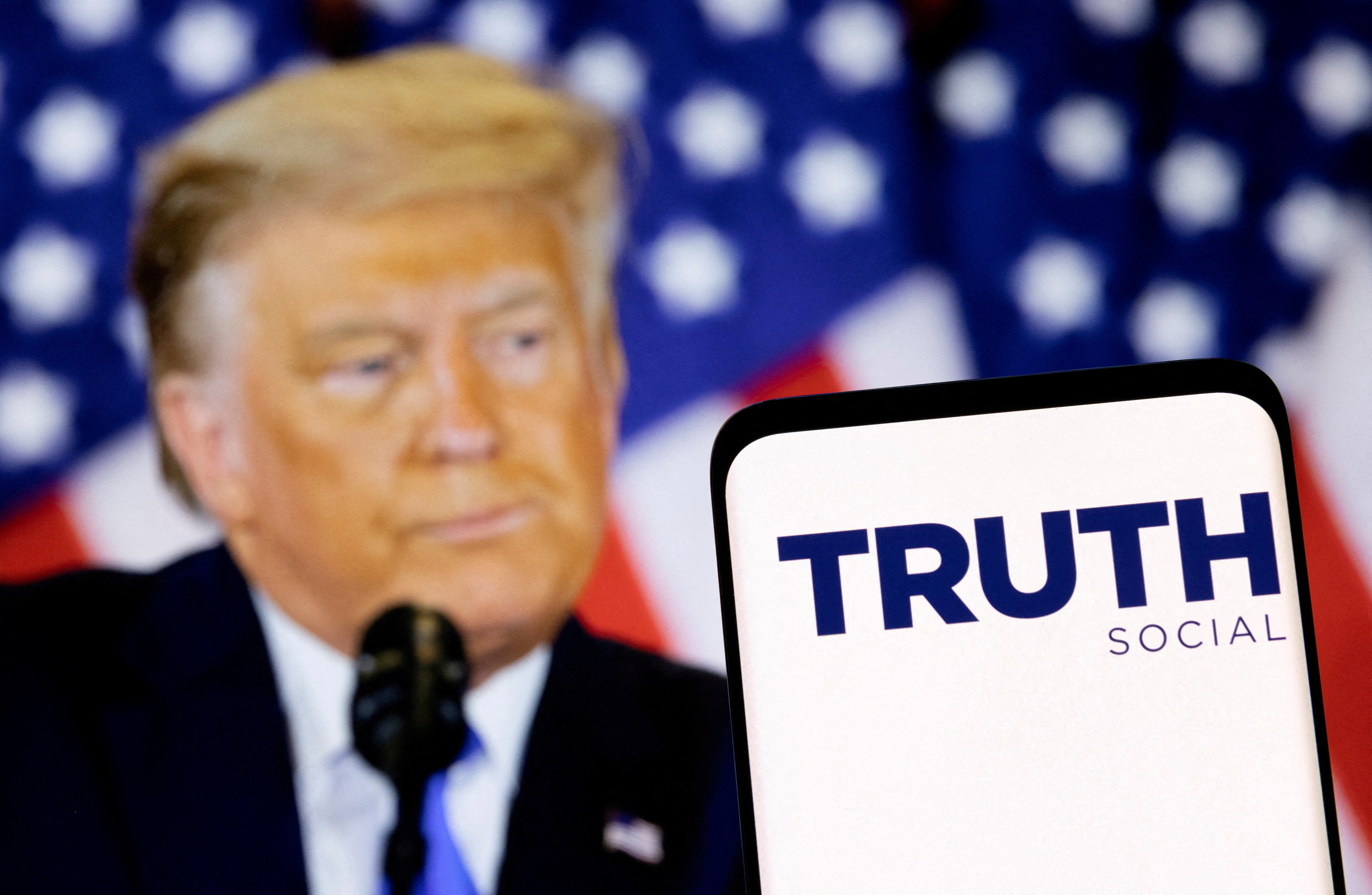 Truth social network logo and display of former U.S. President Donald Trump