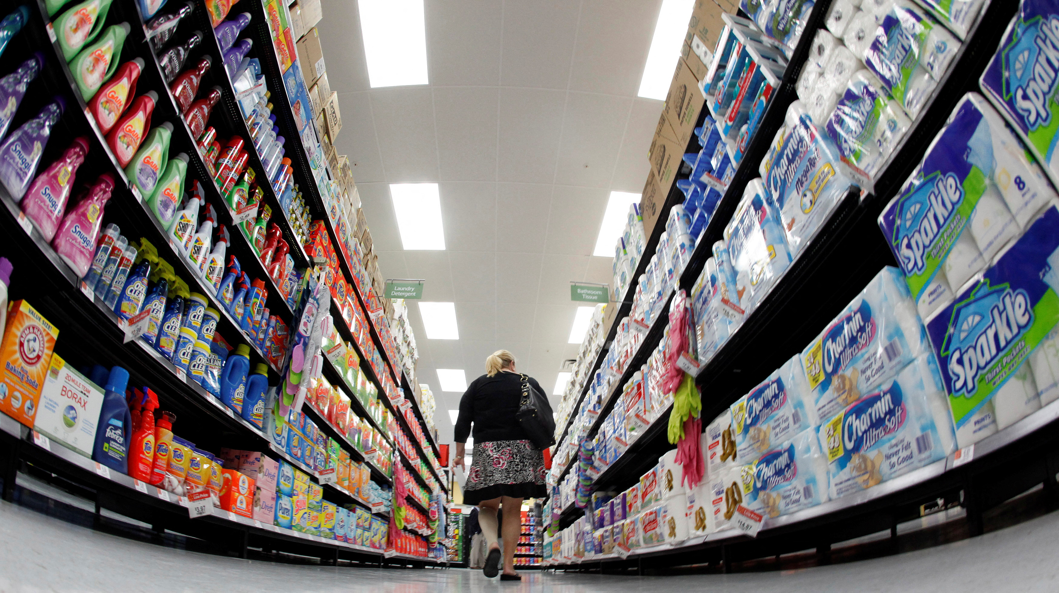 A shopper walks down an aisle in a newly opened Walmart Neighborhood Market in Chicago