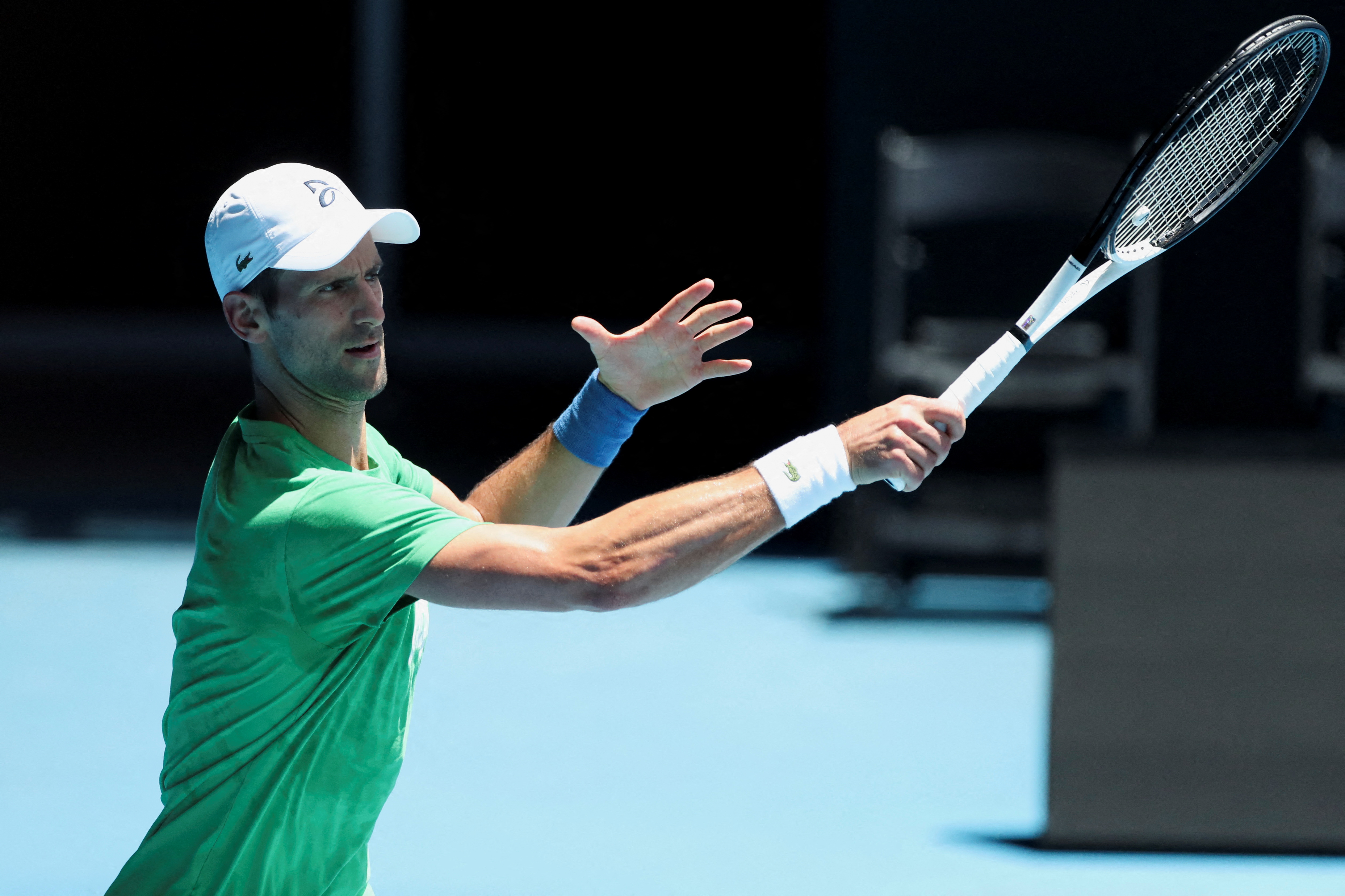 Serbian tennis player Novak Djokovic practices at Melbourne Park as questions remain over the legal battle regarding his visa to play in the Australian Open in Melbourne, Australia, January 13, 2022.  REUTERS/Asanka Brendon Ratnayake