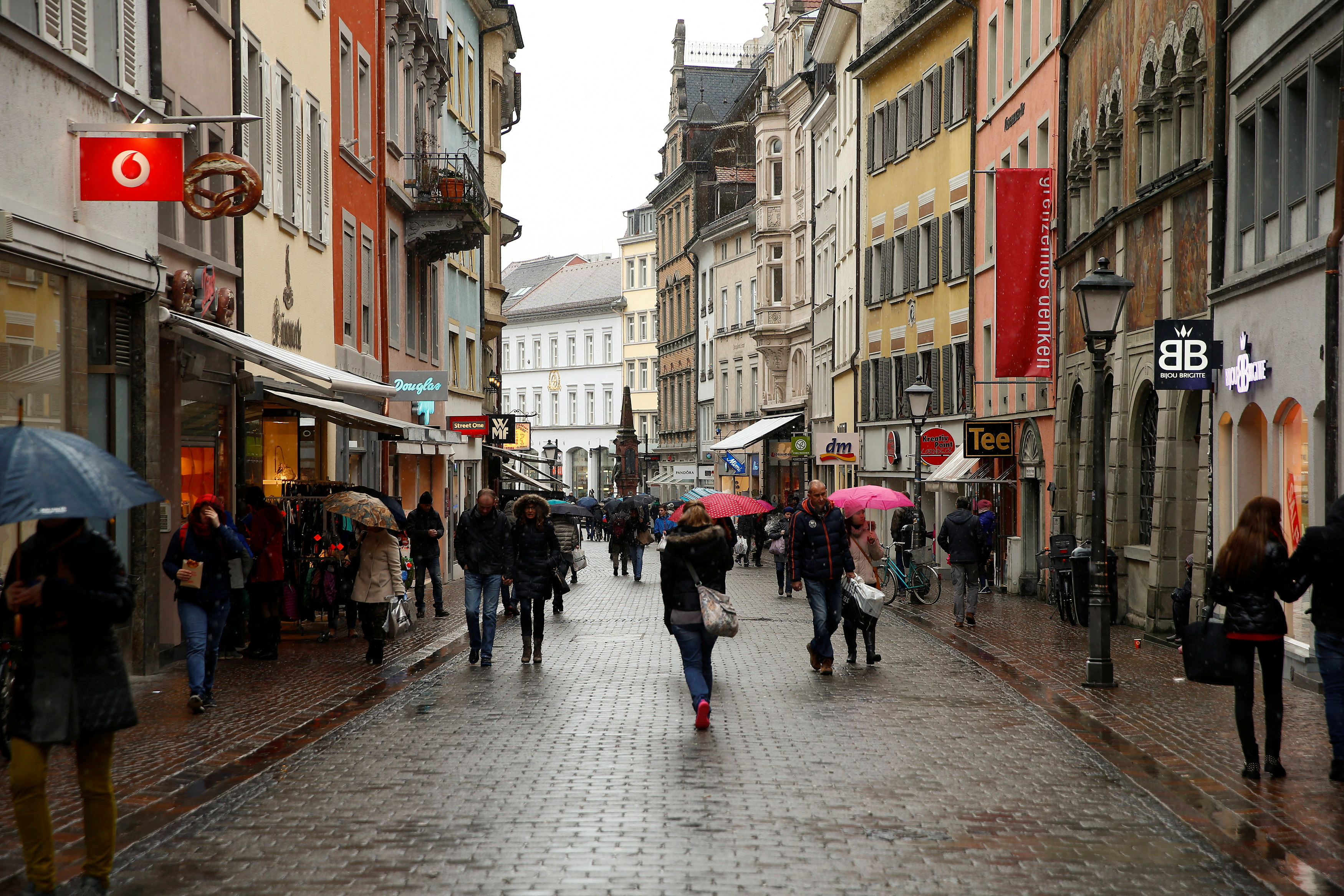 People walk on a shopping street in the southern German town of Konstanz