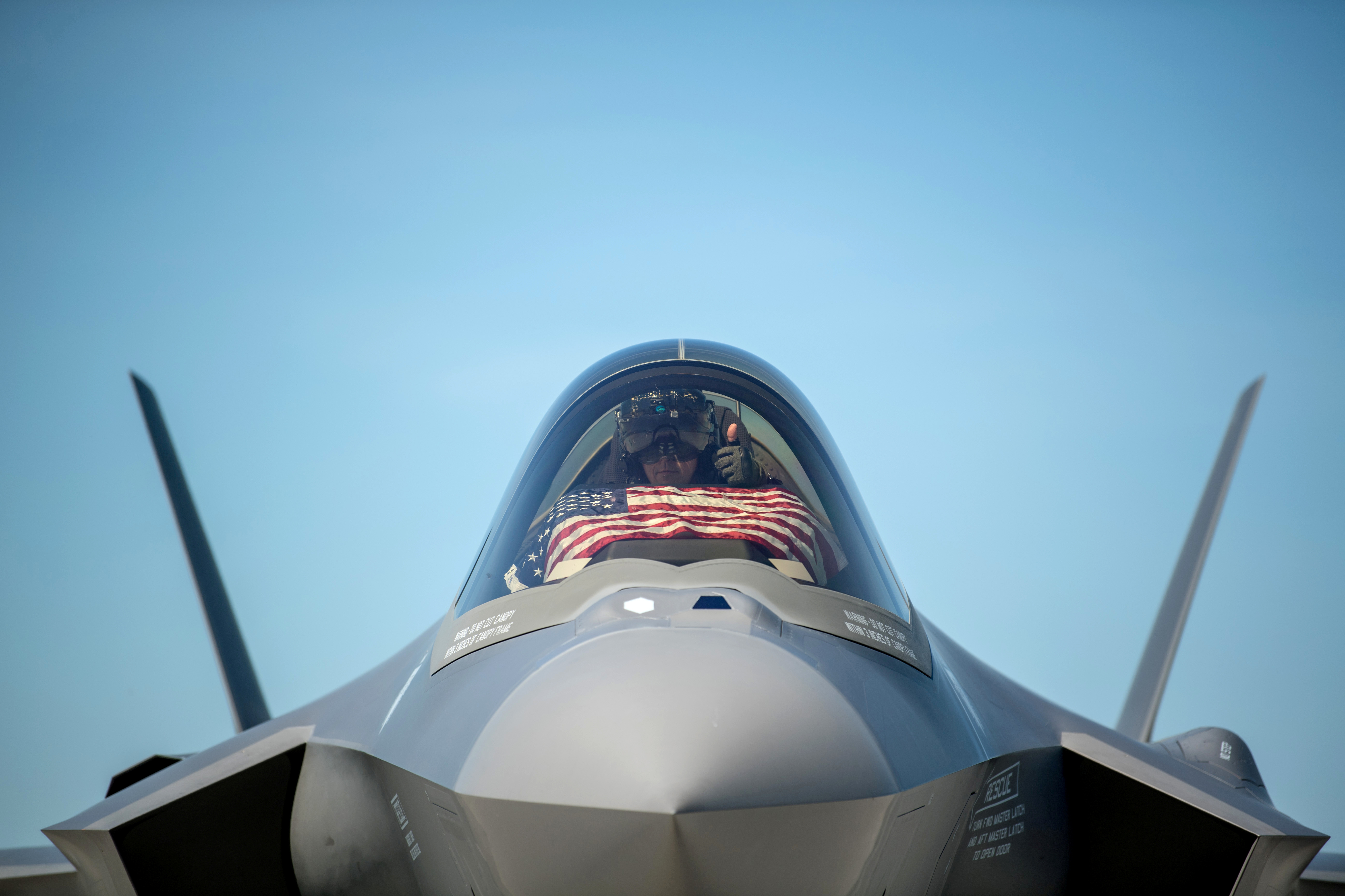 An F-35 pilot prepares for take off from the Vermont Air National Guard Base with the flag of the United States