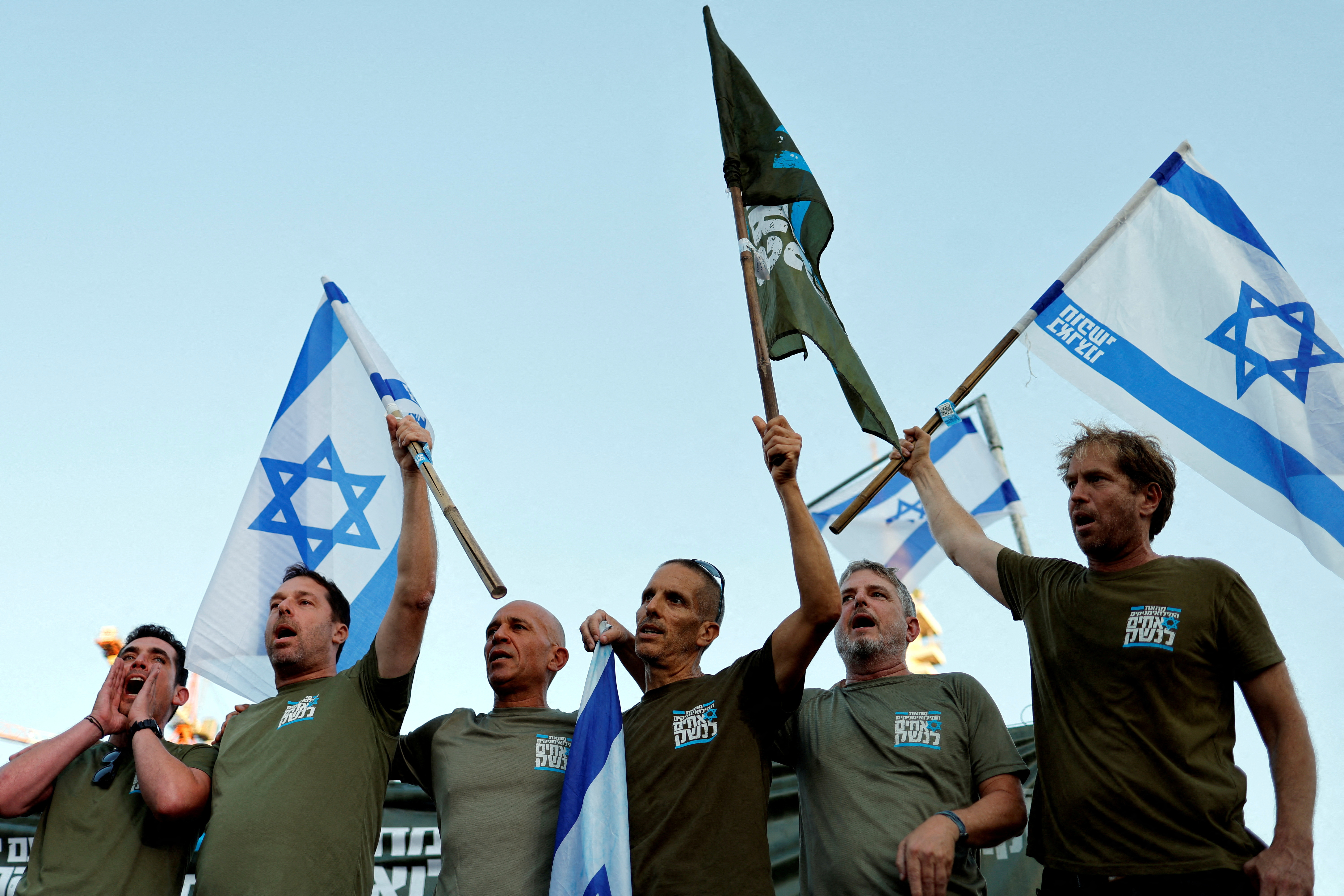 Israeli military reservists sign pledge to suspend voluntary military service if the government passes judicial overhaul legislation near the defence ministry in Tel Aviv