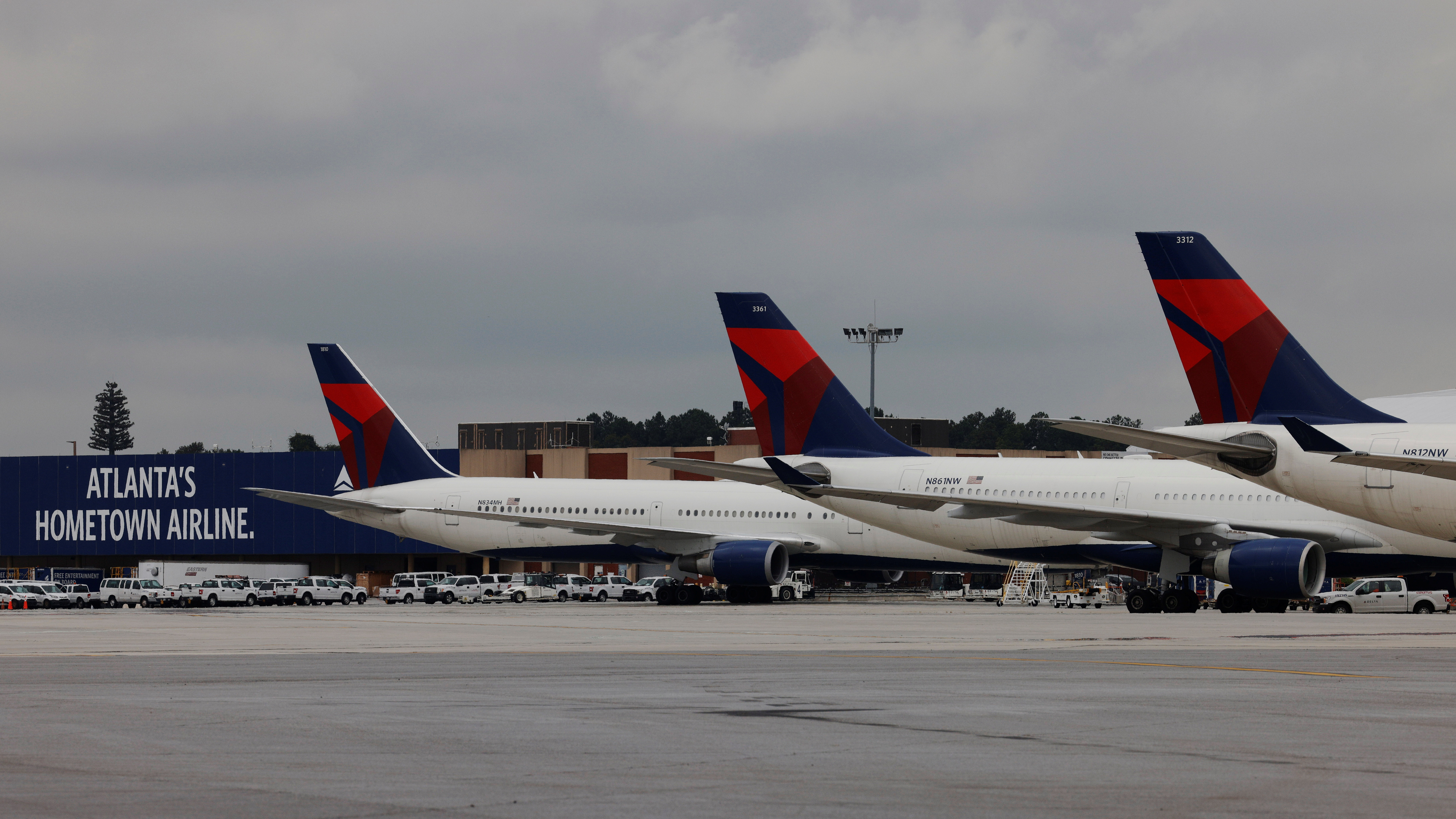 Delta Air Lines planes are parked at their gates in Atlanta