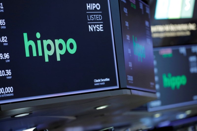 Signage is seen for insurance technology startup Hippo Enterprises Inc on the trading floor at the New York Stock Exchange (NYSE) during their initial public offering (IPO) in Manhattan, New York City, U.S., August 3, 2021. REUTERS/Andrew Kelly/File Photo
