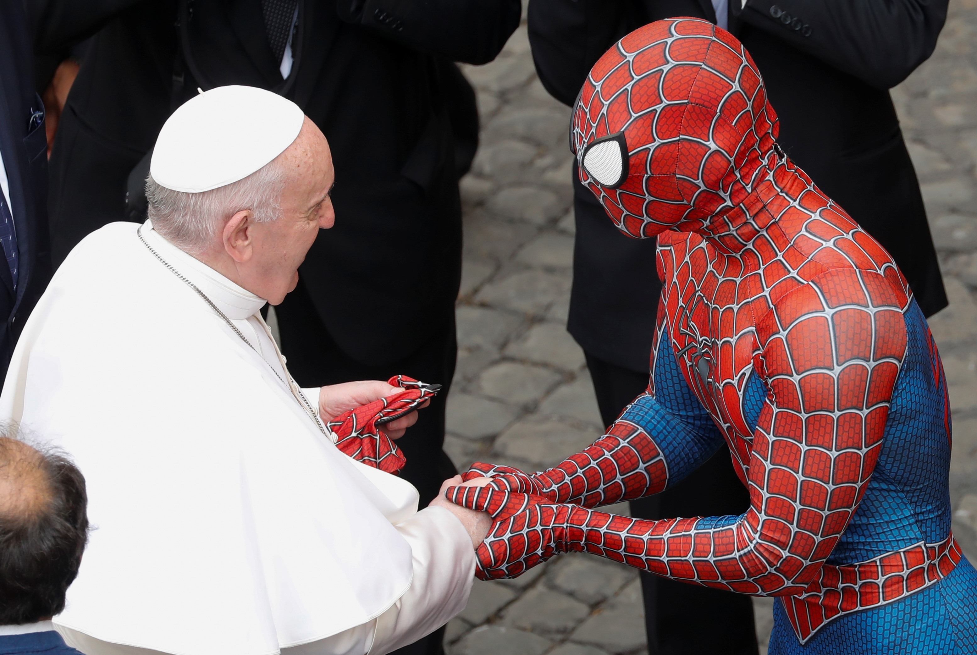 Pope Francis greets a person dressed as Spiderman after the general audience, amid the coronavirus disease (COVID-19) pandemic, at the Vatican, June 23, 2021. REUTERS/Remo Casilli