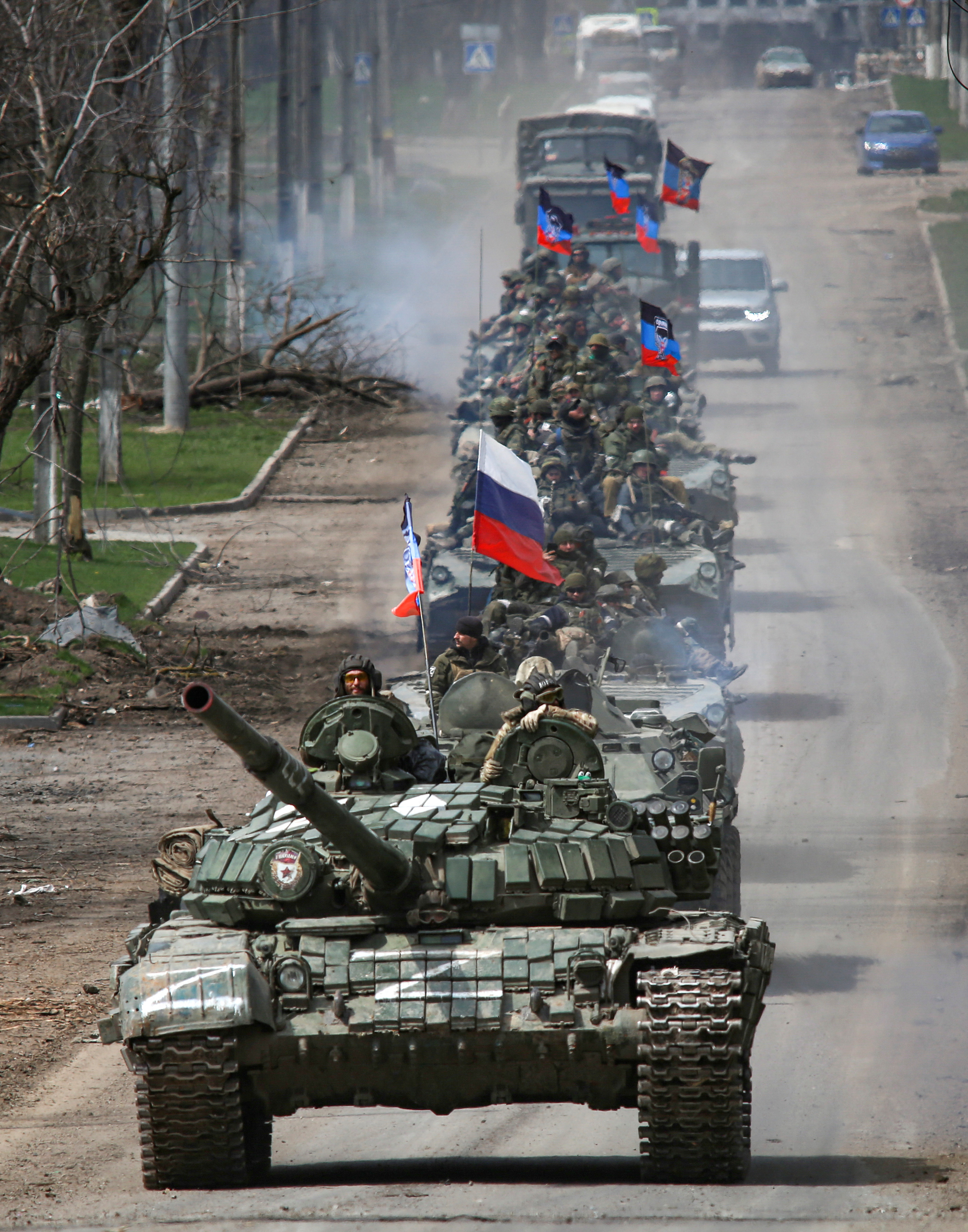 An armoured convoy of pro-Russian troops moves along a road in Mariupol