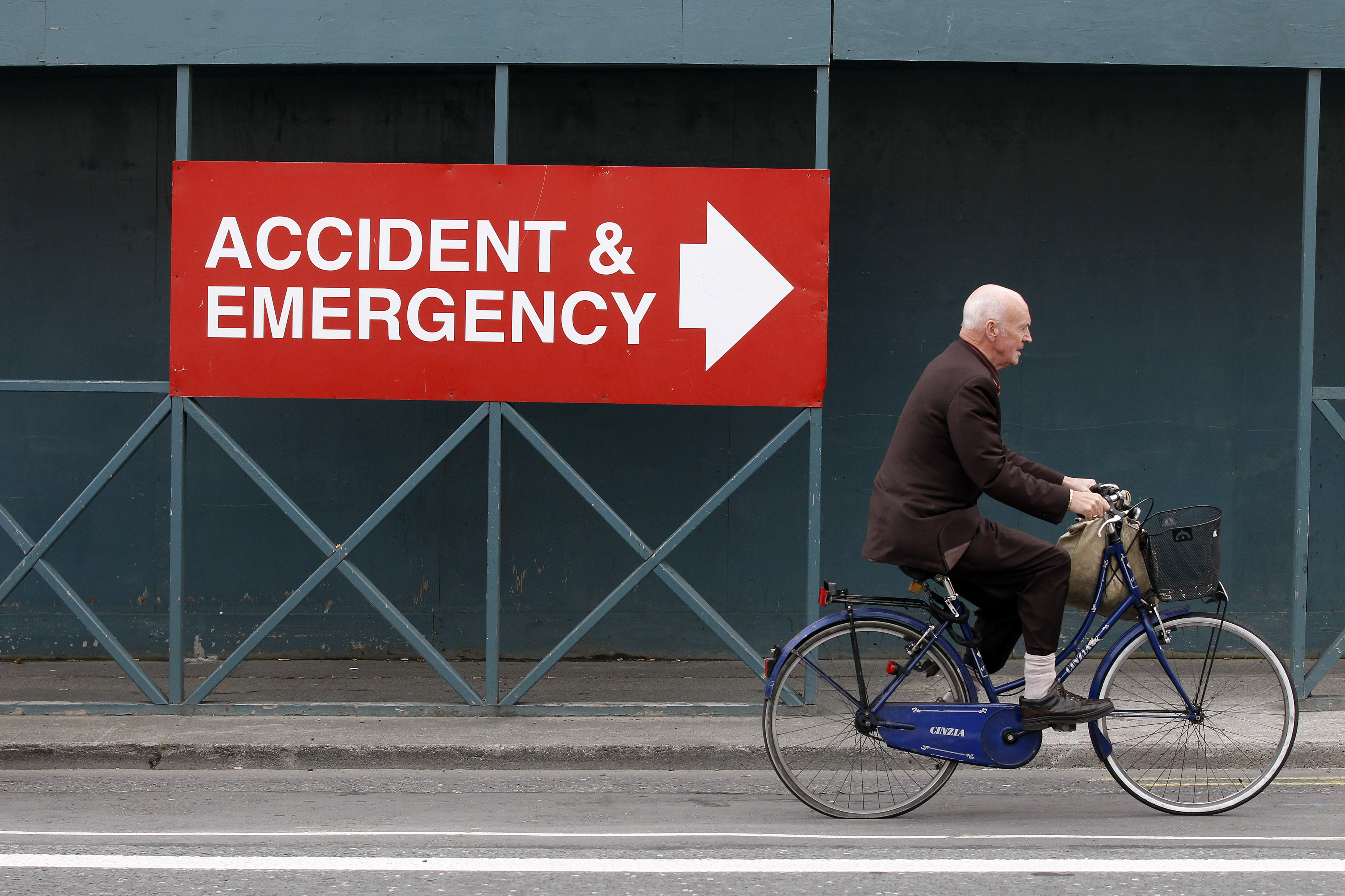 A man rides a bicycle near the entrance to the Mater Hospital in Dublin