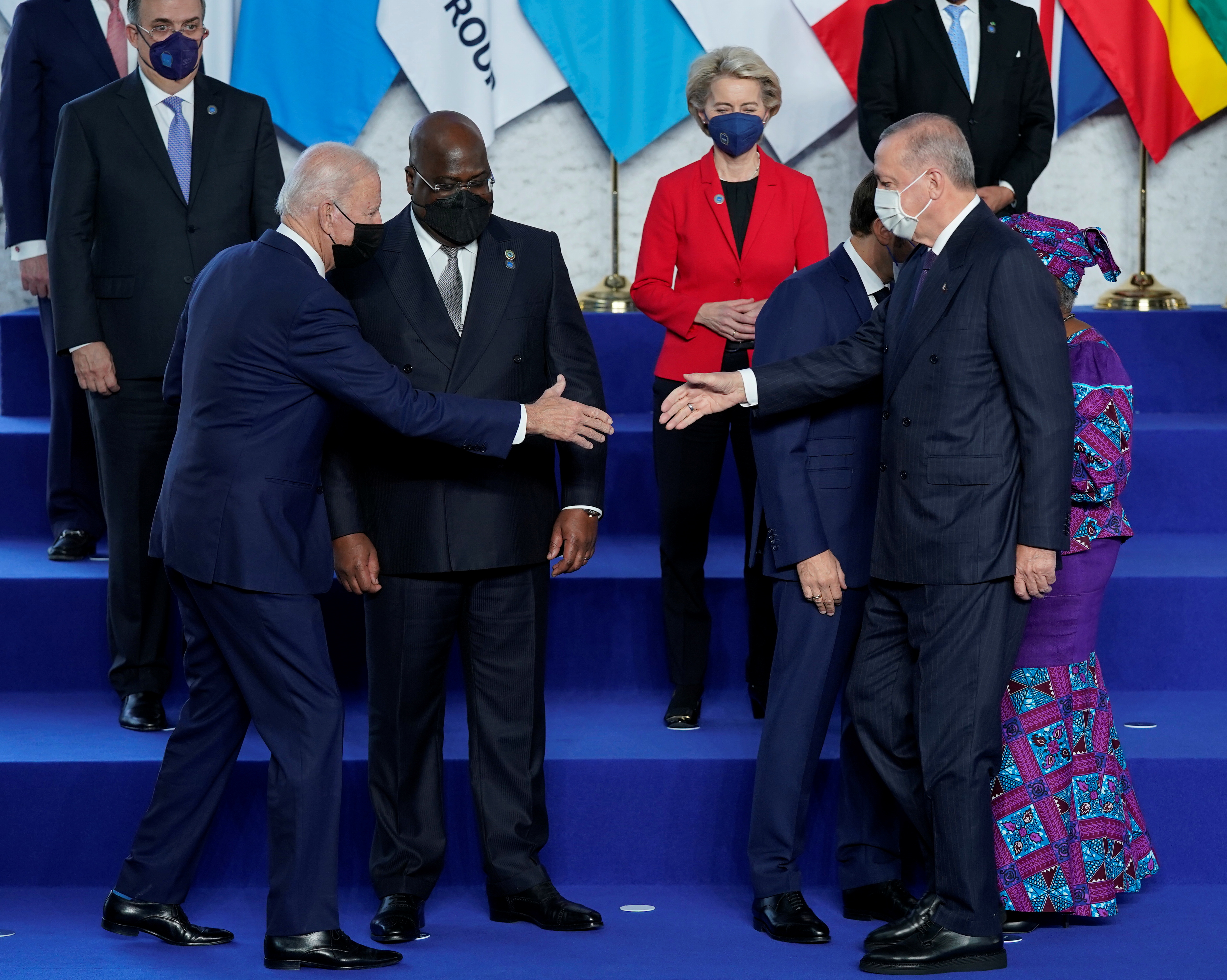 U.S. President Joe Biden reaches out to shake hands with Turkey's President Recep Tayyip Erdogan during a group photo at the G20 summit in Rome, Italy October 30, 2021. Evan Vucci/Pool via REUTERS