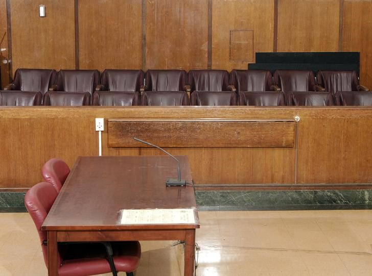 Jurors sit in the jury box (rear) and the defense sits at the small table (front L), in Part 31, Room 1333 of the New York State Supreme Court, Criminal Term at 100 Centre Street, in New York