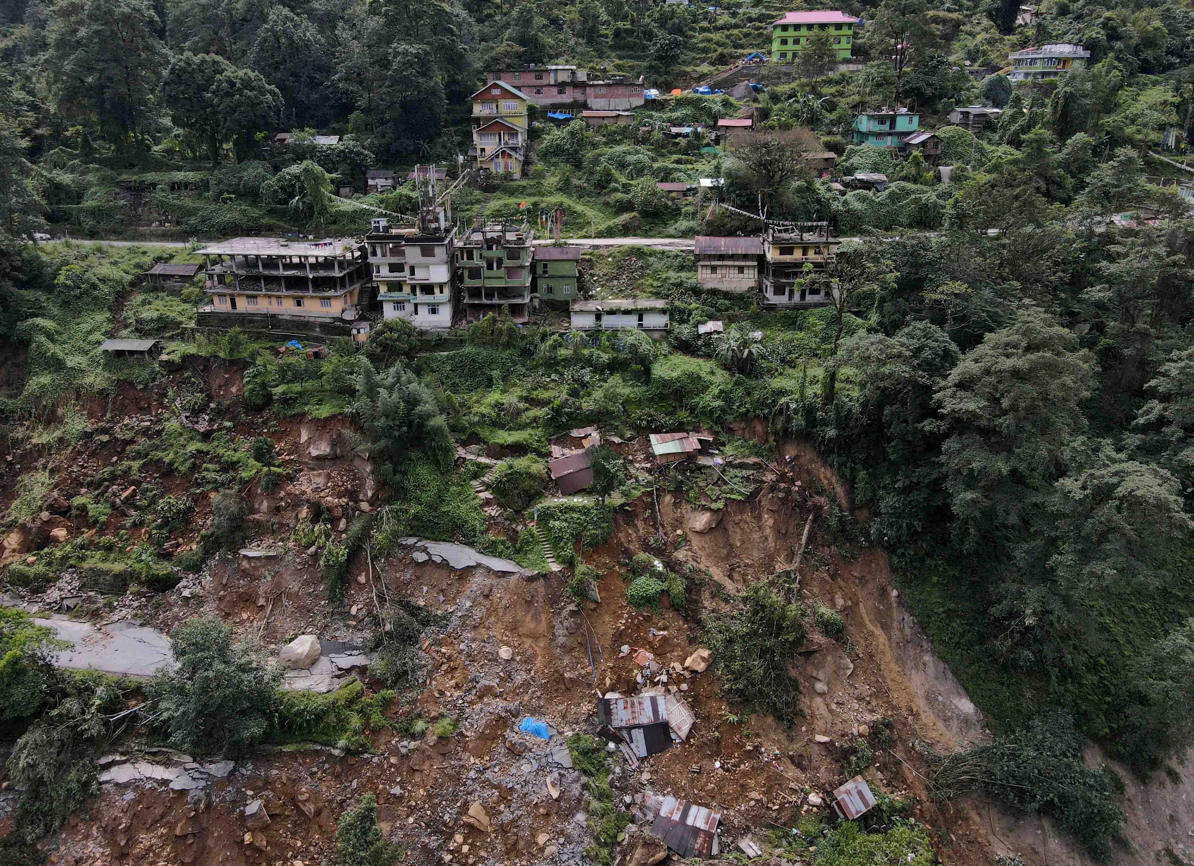 A drone view of damaged roads and houses that were washed away by flash floods in Naga-Namgor village, Sikkim