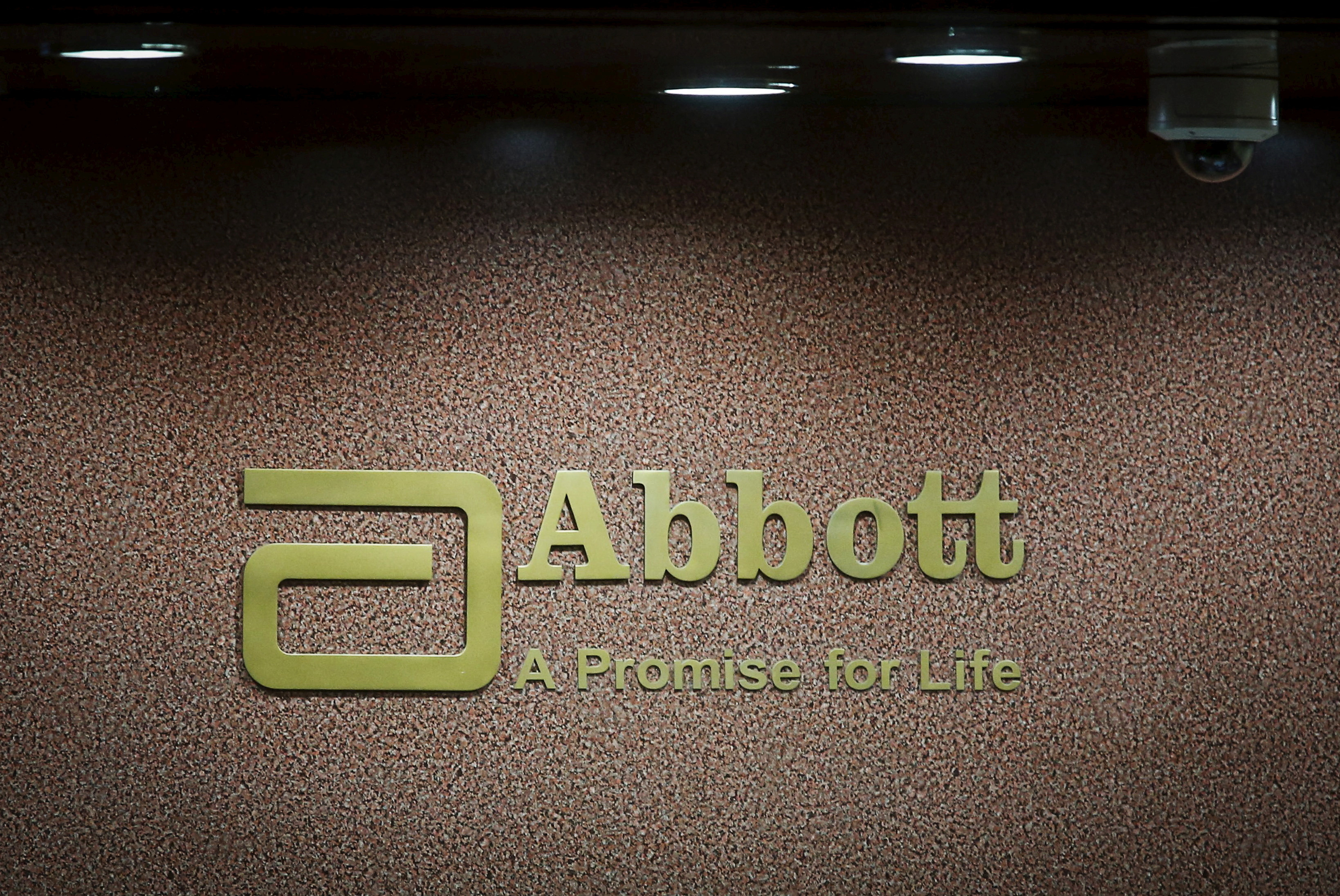An Abbott company logo is pictured at the reception of its office in Mumbai