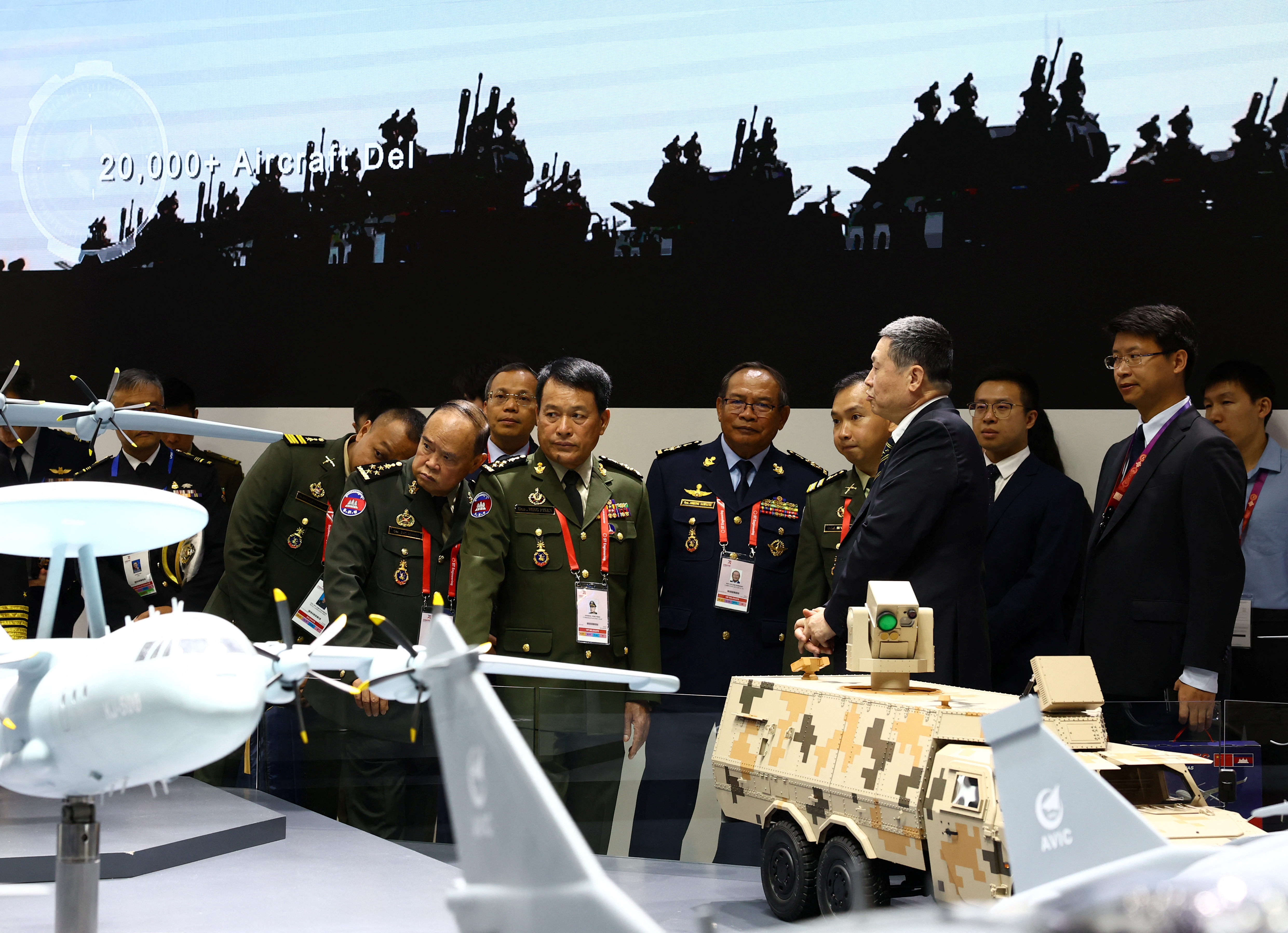 Cambodia's Armed Forces Commander-in-chief Vong Pisen tours the Aviation Industry Corporation of China (AVIC) booth during the Singapore Airshow at Changi Exhibition Centre in Singapore
