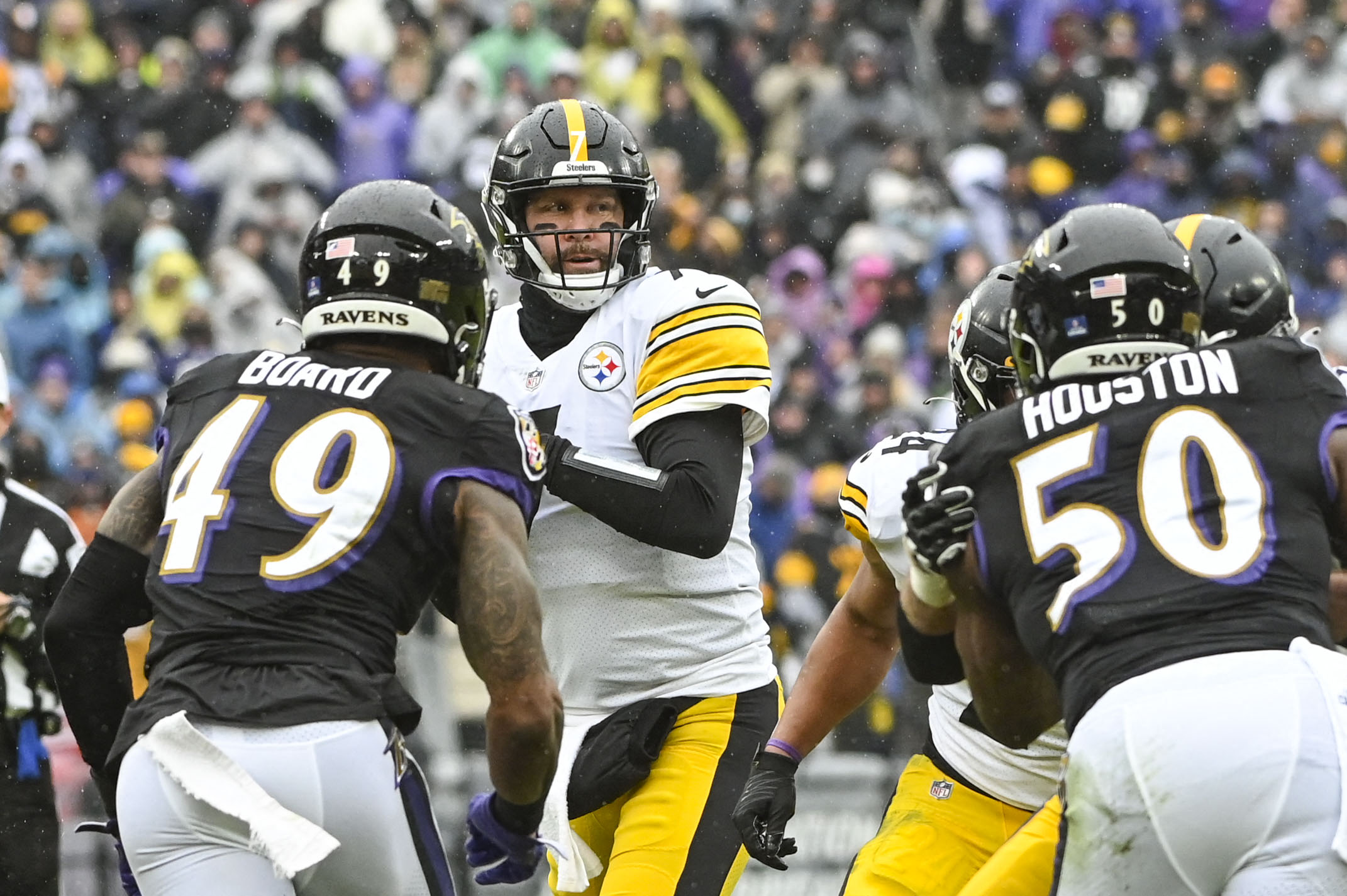 Jan 9, 2022; Baltimore, Maryland, USA;  Pittsburgh Steelers quarterback Ben Roethlisberger (7) drops back to pass as Baltimore Ravens linebacker Chris Board (49) and outside linebacker Justin Houston (50) aplly pressure during the first quarter at M&T Bank Stadium. Mandatory Credit: Tommy Gilligan-USA TODAY Sports